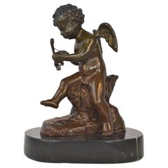 Magnifique figurine de Cupidon assise en bronze ancien