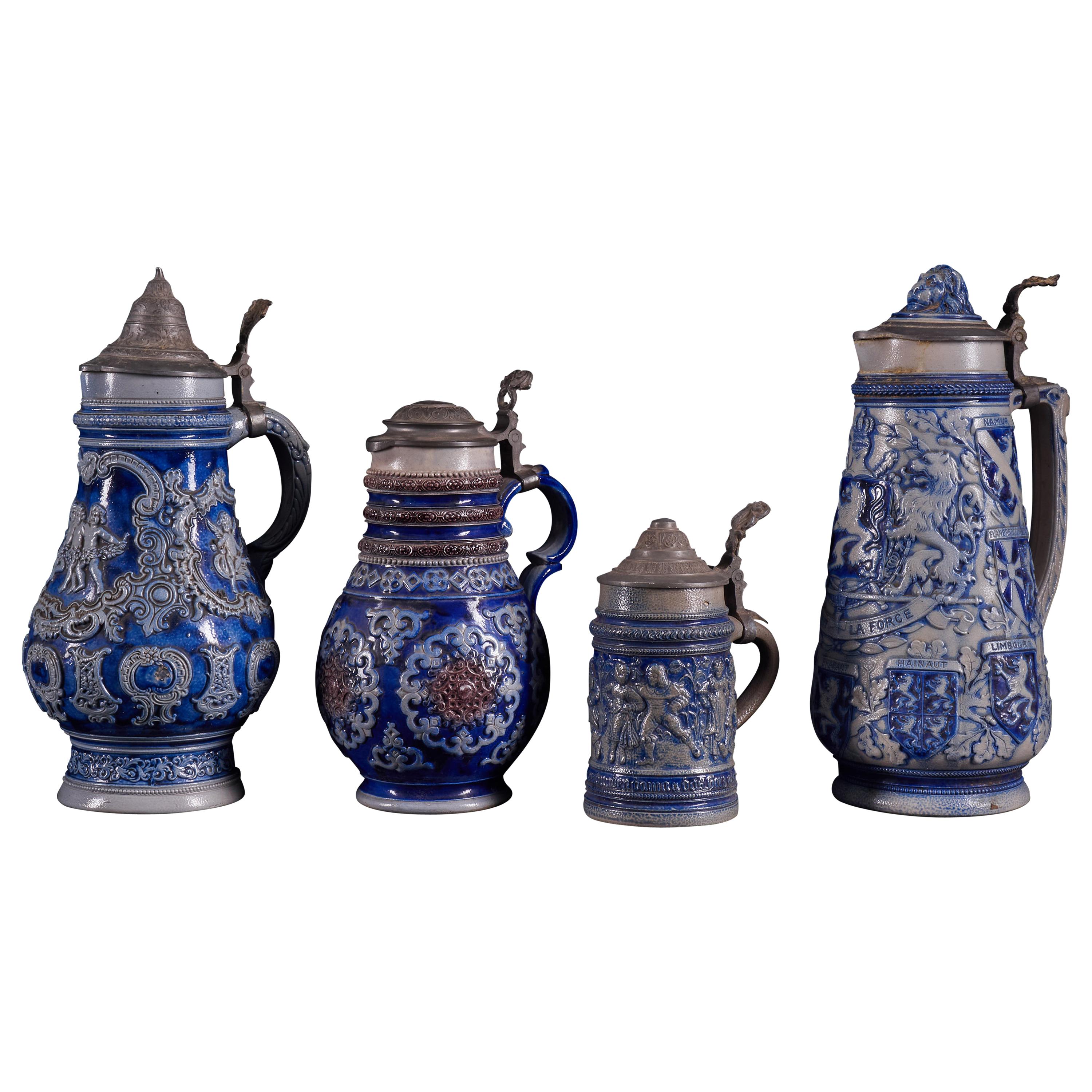 Beautiful Set of 4 Vintage Ceramic Beer Carafes with Indigo Blue Decorations