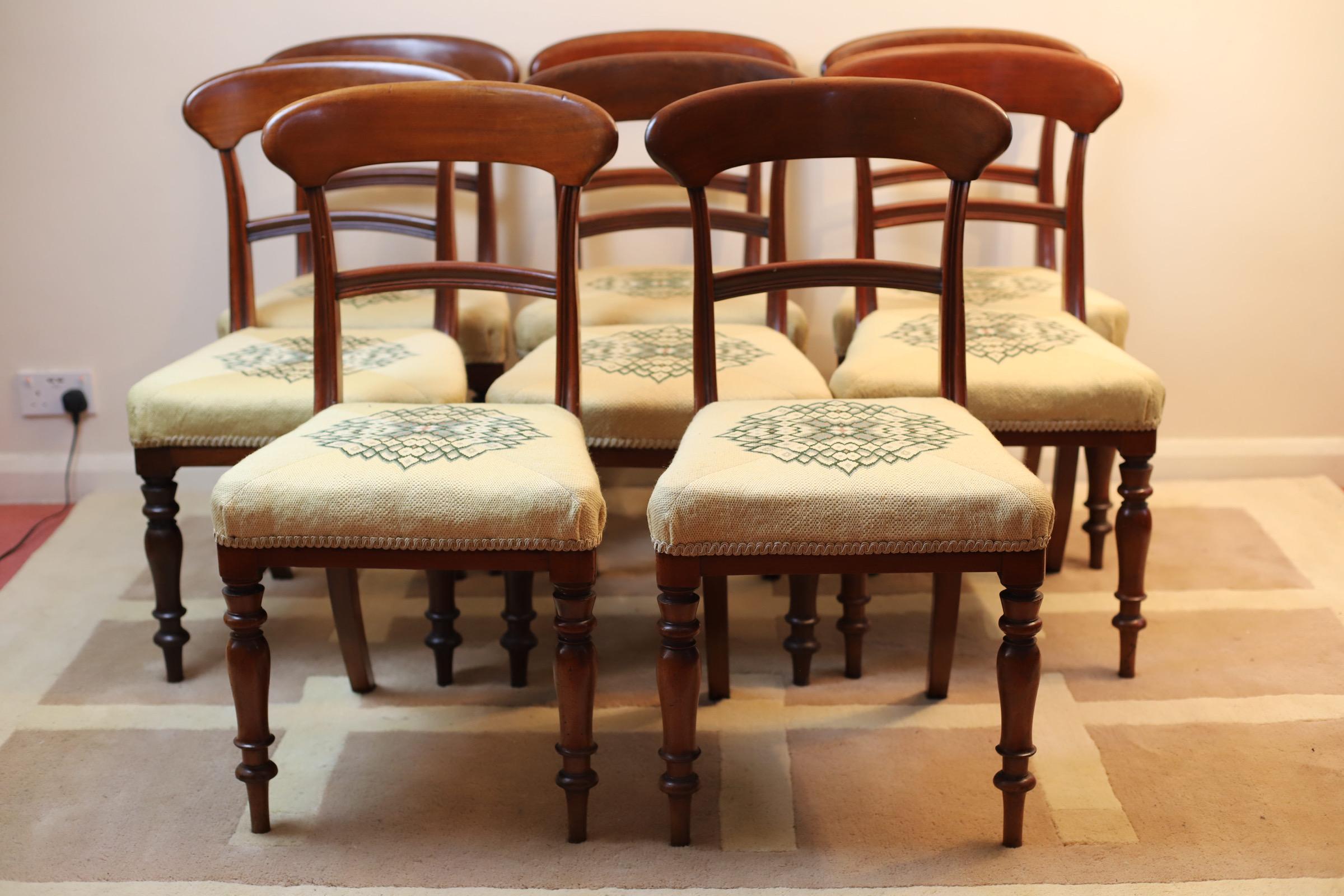 Set of 8 antique Victorian quality mahogany dining chairs having a quality mahogany shaped top rail, reeded splat to the centre standing on turned shaped tapering legs to the front and out swept back leg and overstuffed seats. Some historic extinct
