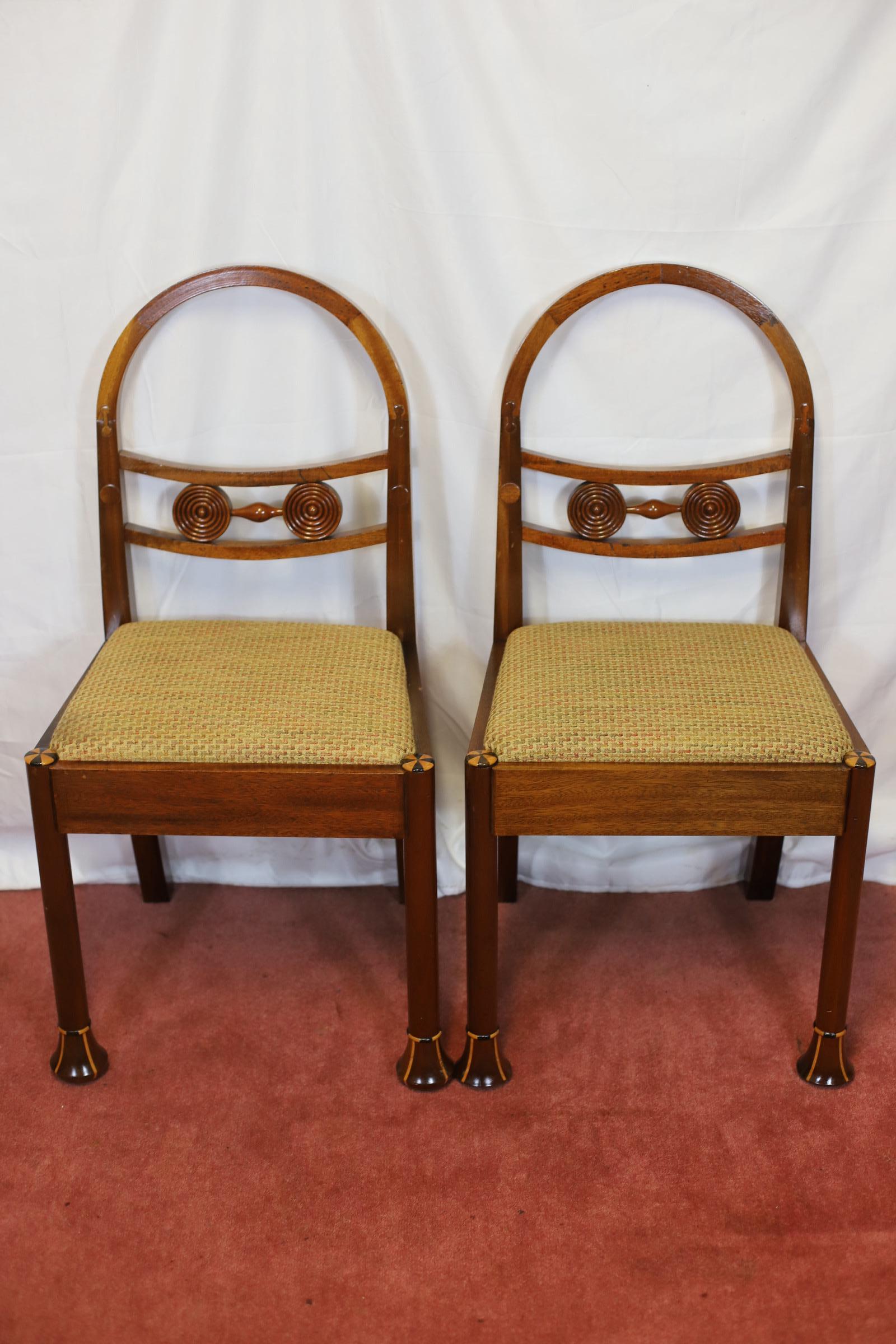 We delight to offer for sale this stunning set of eight hooped back dining chairs with back bar carved circular motifs above an upholstered drop-in seat, inlaid roundel to top of legs and on shaped feet , made by Jeremy Green .
Carvers 
H 96 cm W 56