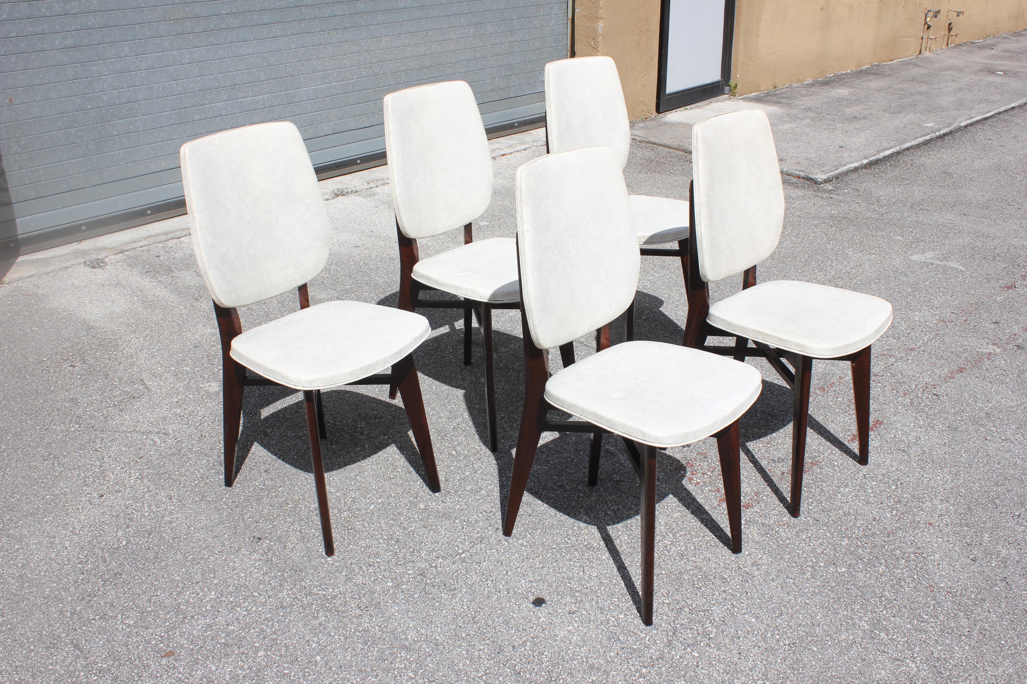 A set of 5 French Art Deco solid mahogany dining chairs. The chair frames are in excellent condition. But the (Reupholstery is vinyl recommended for all 5 dining chairs).