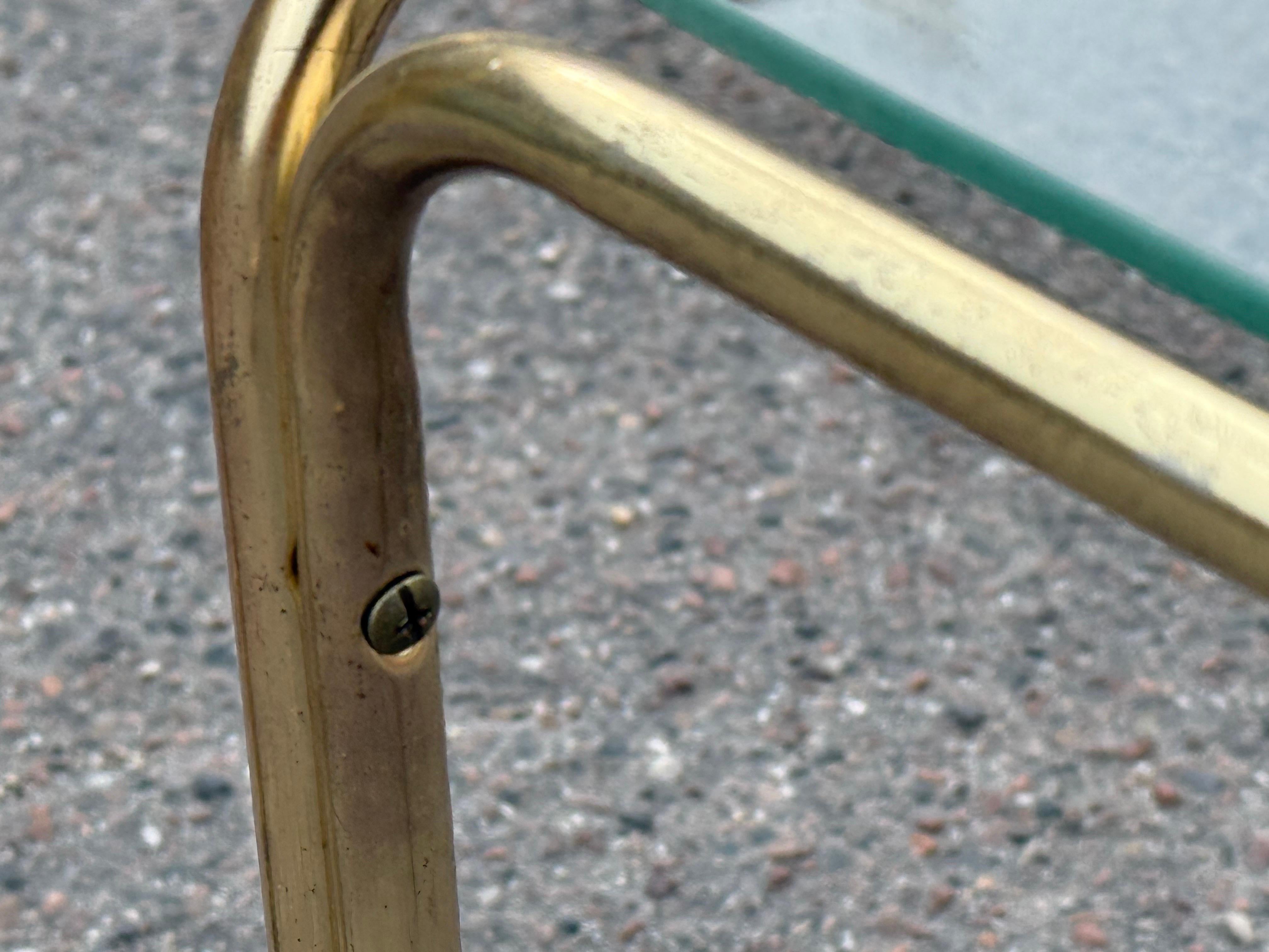 Brass Beautiful set of French 1970's nesting tables in brass and glass For Sale