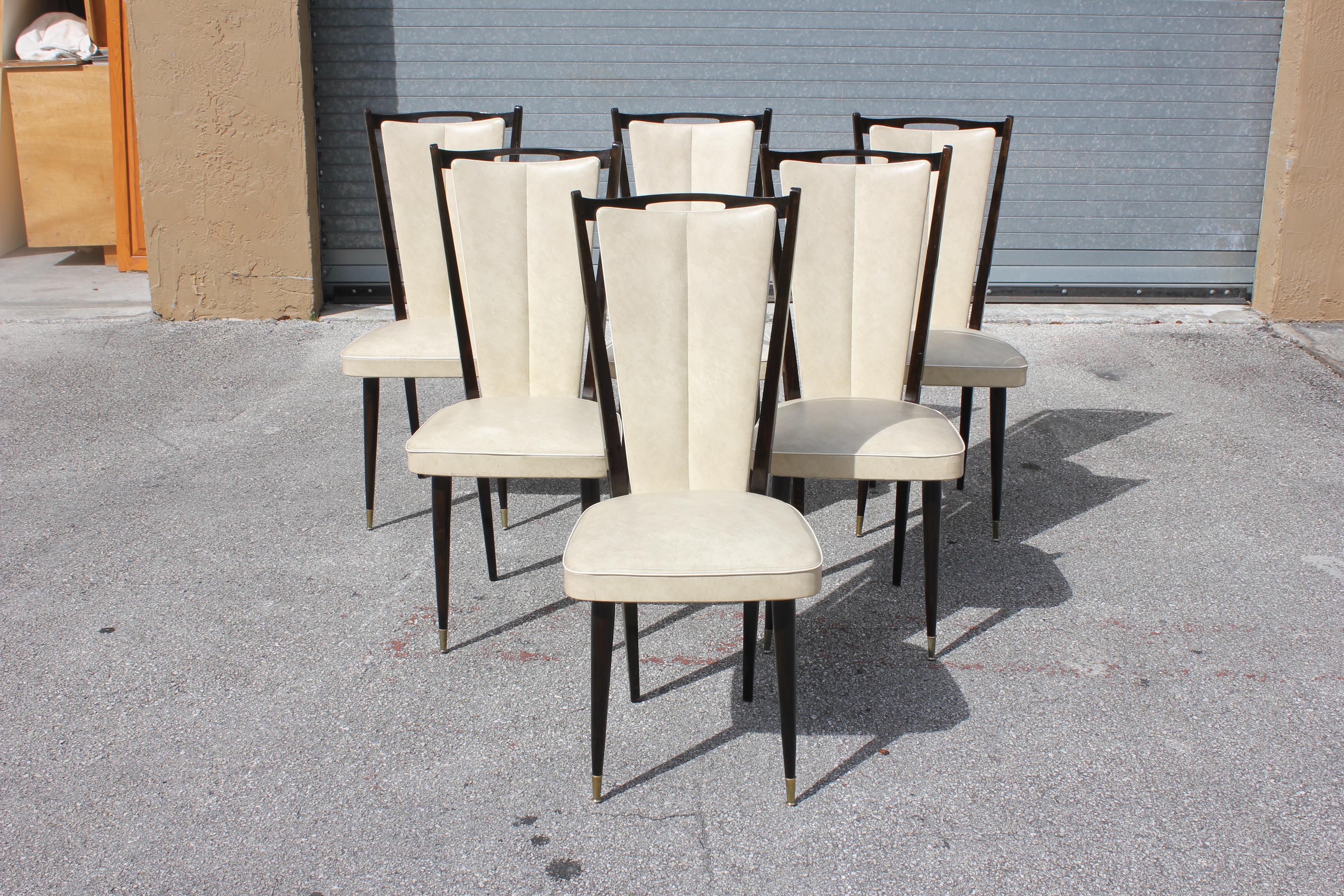 Set of six French Art Deco or Art modern dining chairs solid Mahogany, the chair frames are in excellent condition.(Reupholstery is vinyl recommended to be change for all 6 dining chairs), but the color of the dining chairs are beautiful, circa