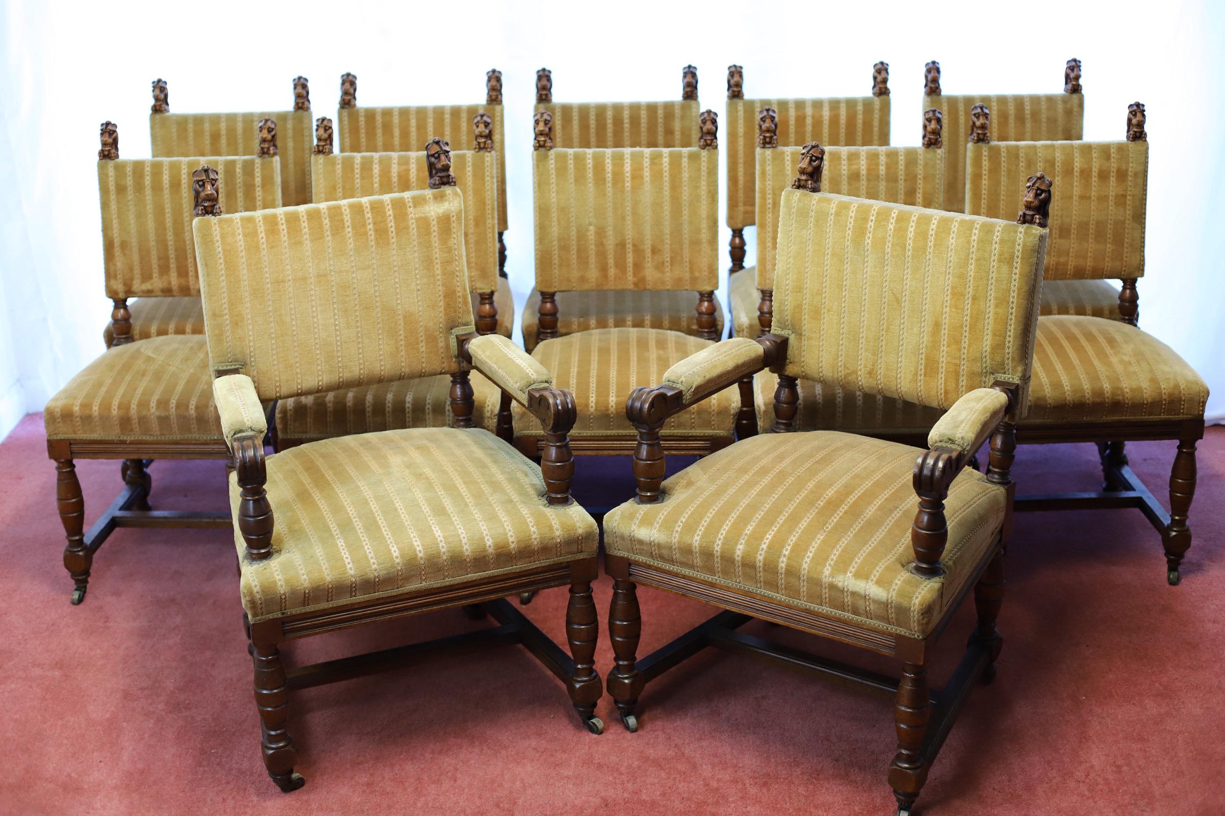 We delight to offer for sake this stunning set of twelve Victorian carved oak and upholstered dining chairs, late 19th century , including two elbow chairs , with channel moulded show frames around rectangular backrests, each with twin carved lion's