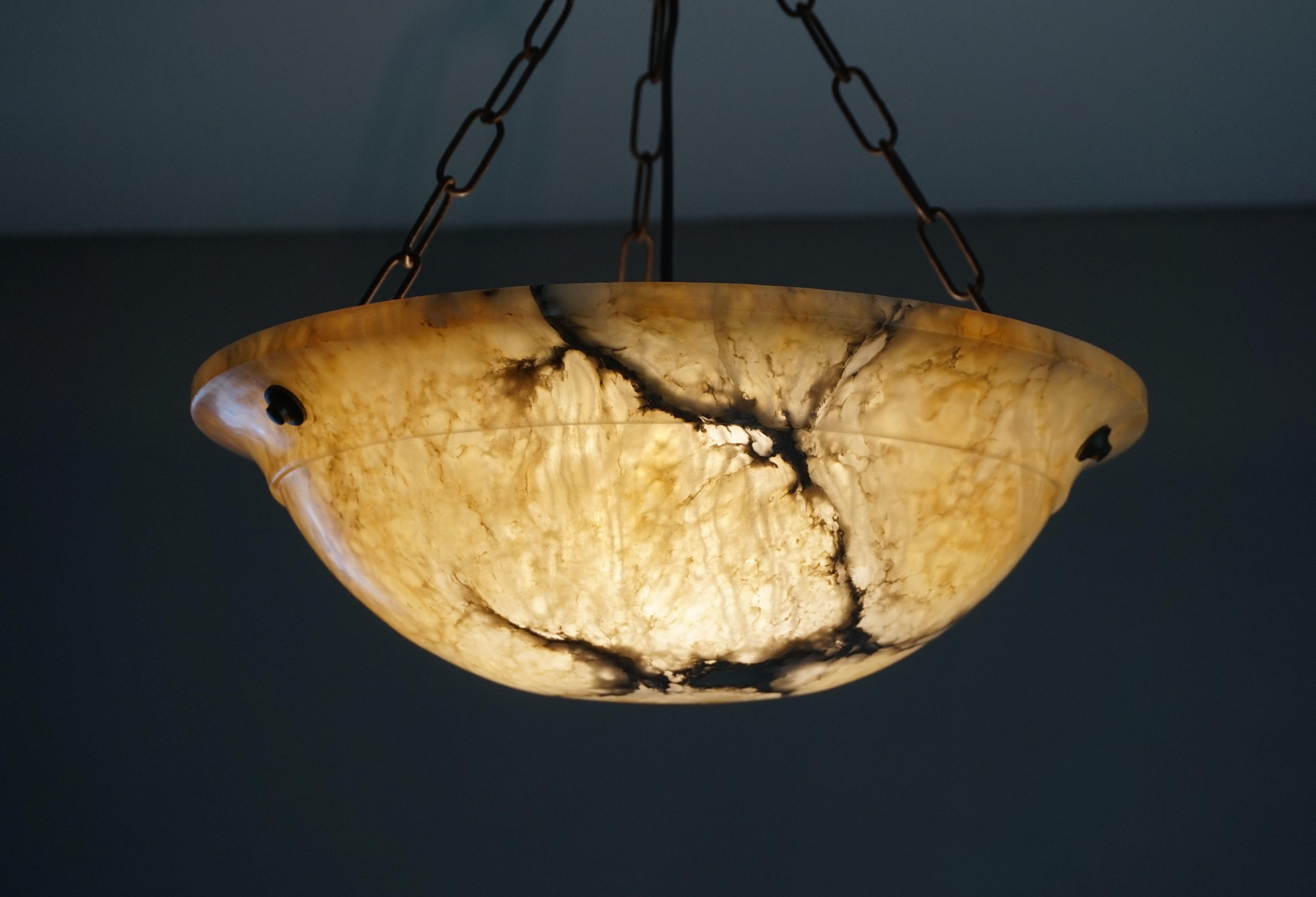Great design, rare color and excellent condition alabaster light fixture.

If you are looking for a stylish and timeless light to grace your living space then this Art Deco fixture could be the one. All hand-crafted in the early 1900s this natural