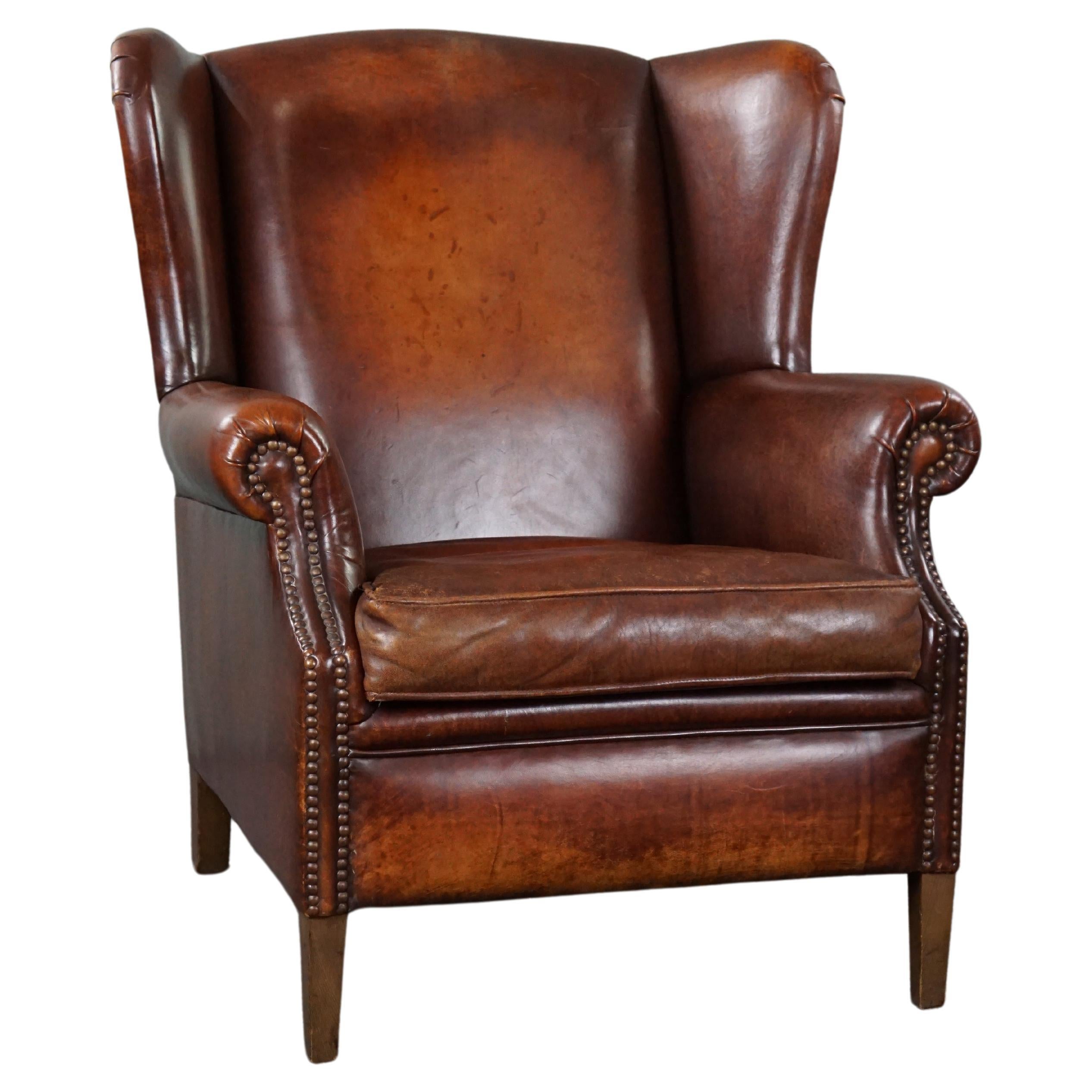 Distressed leather wingback chair hot sale