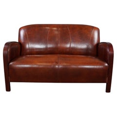 Used Beautiful sheepskin Art Deco 2-seater sofa, new condition