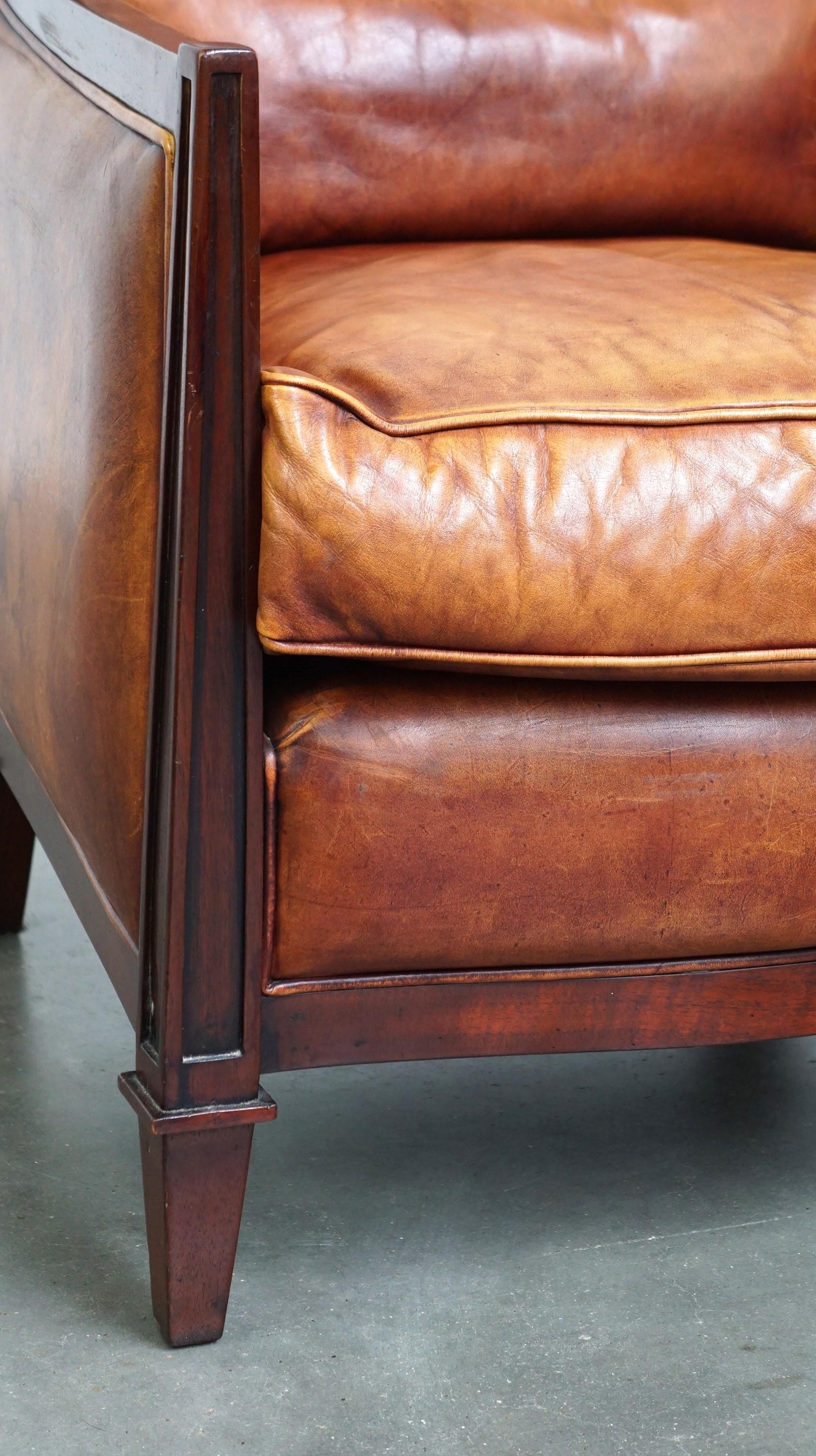 Beautiful sheepskin Art Deco design armchair finished with wood For Sale 3