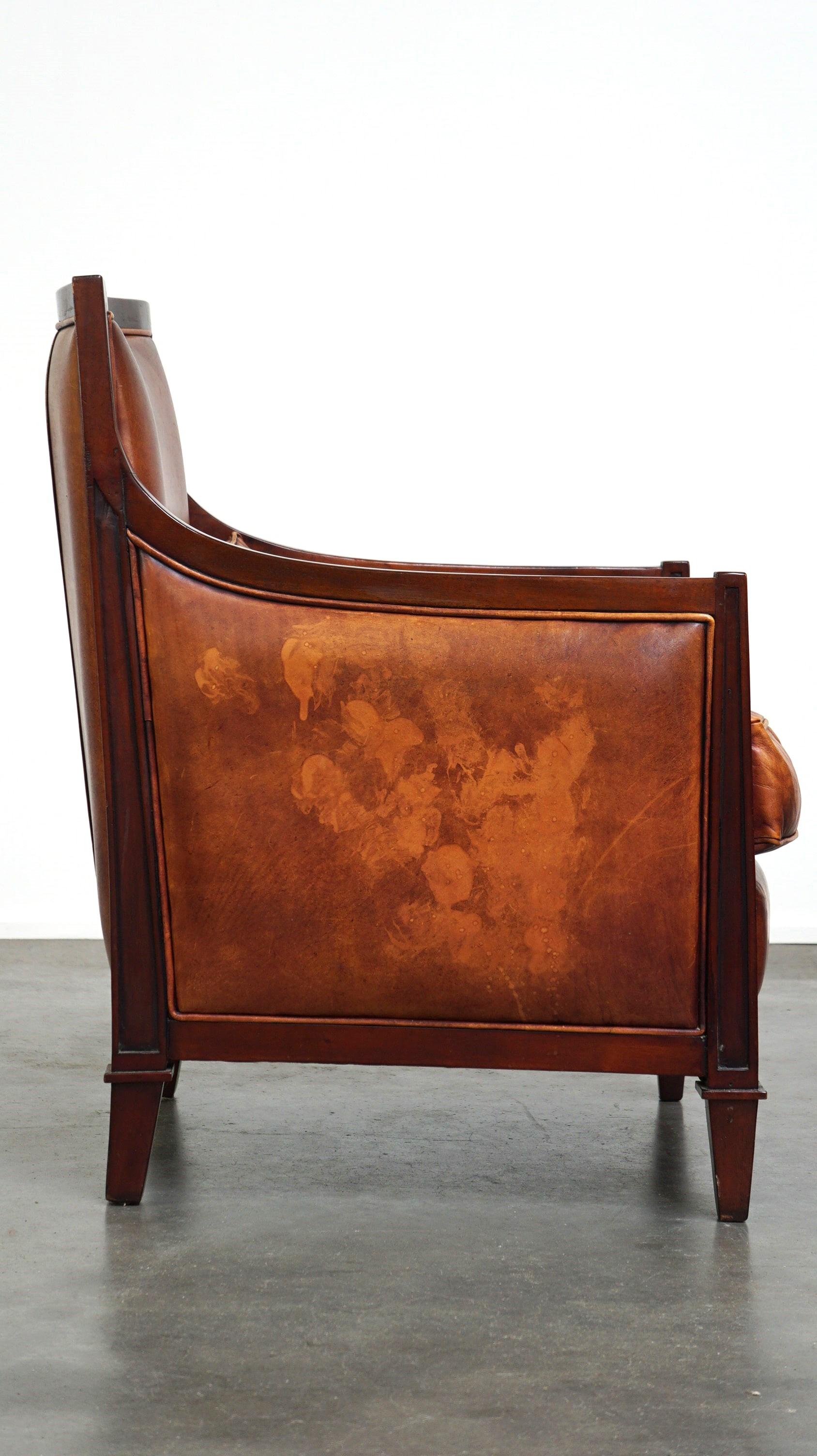 Dutch Beautiful sheepskin Art Deco design armchair finished with wood For Sale