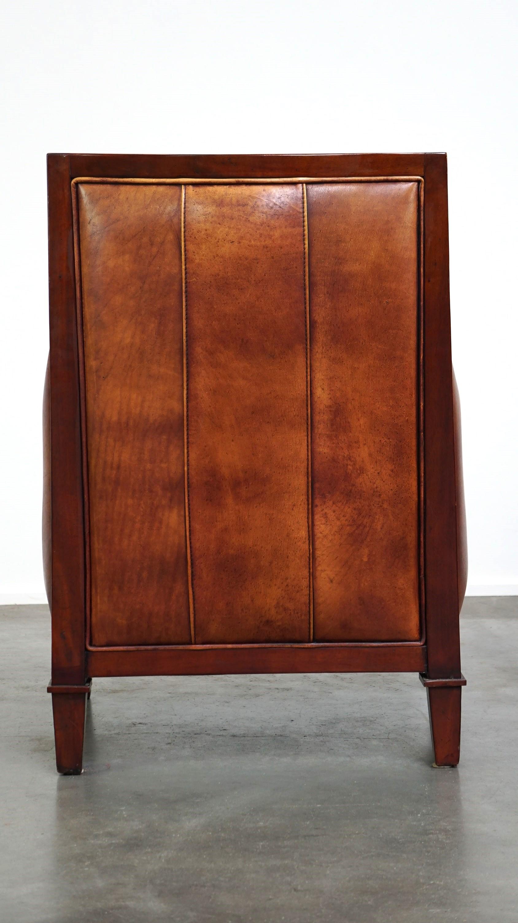 Hand-Crafted Beautiful sheepskin Art Deco design armchair finished with wood For Sale
