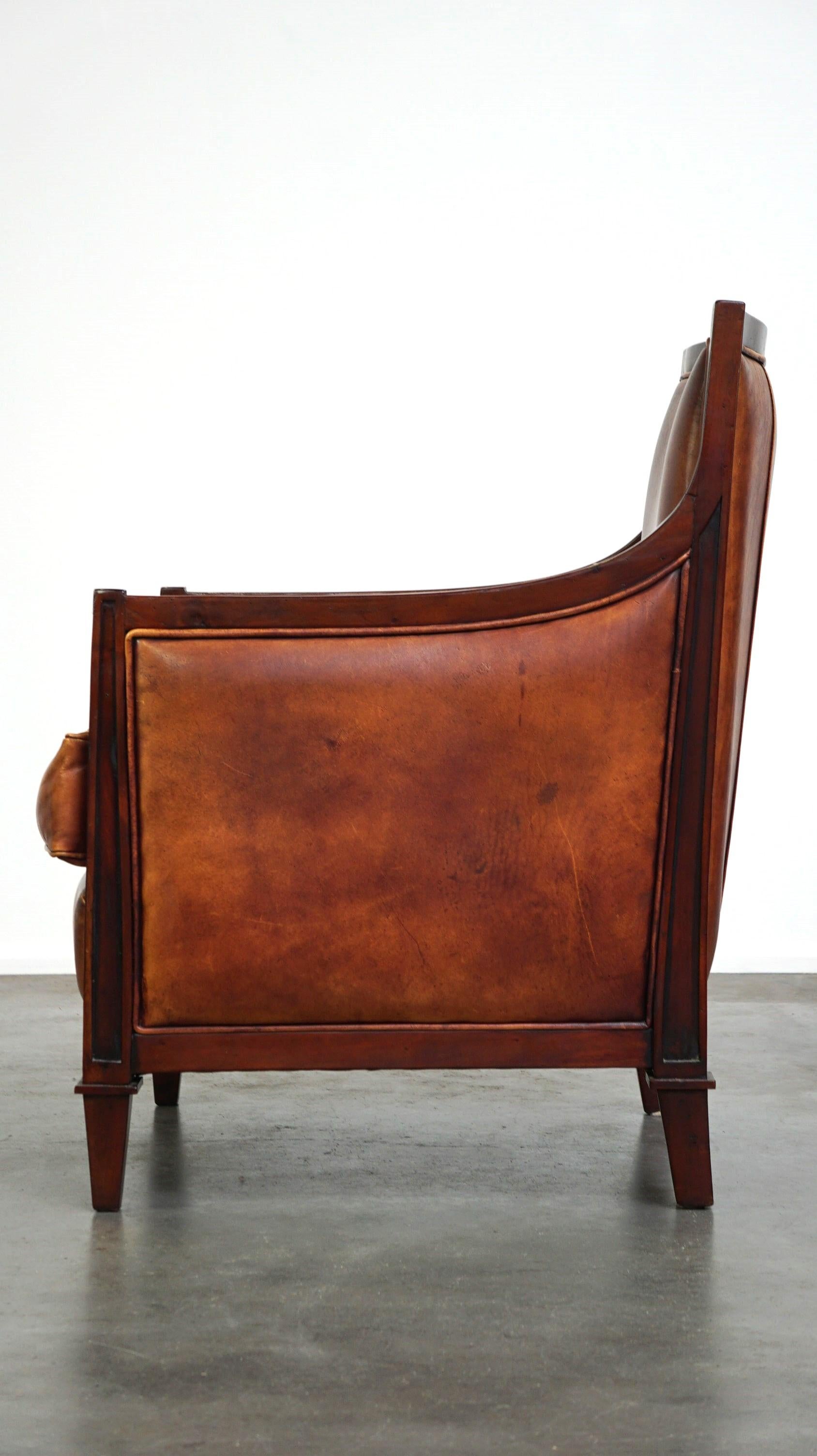 Beautiful sheepskin Art Deco design armchair finished with wood In Good Condition For Sale In Harderwijk, NL