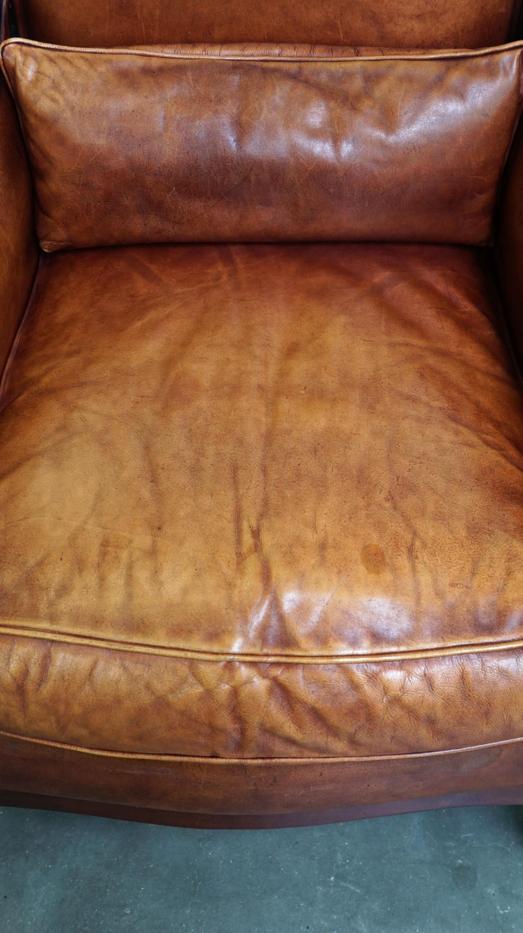 Contemporary Beautiful sheepskin Art Deco design armchair finished with wood For Sale