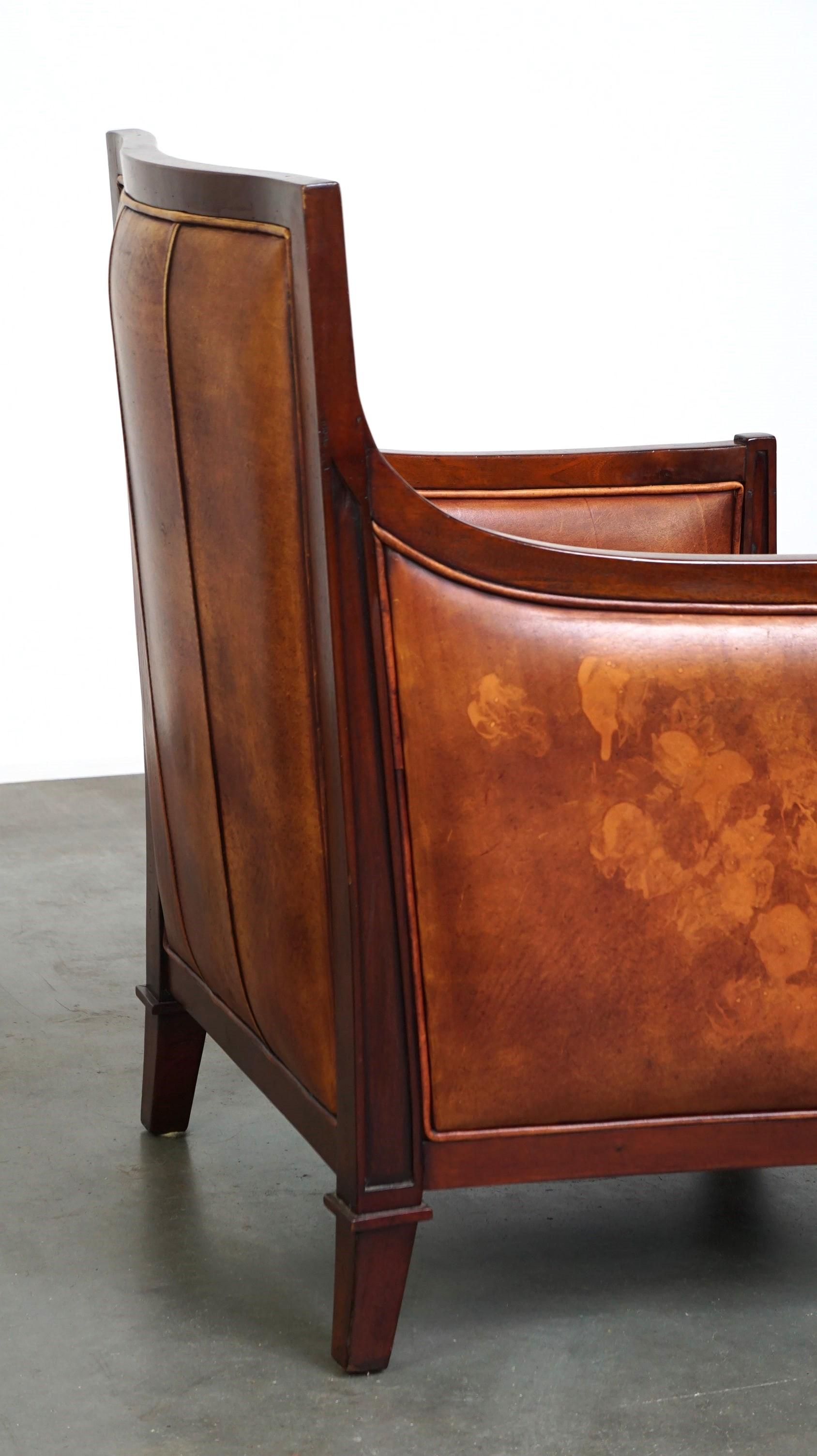 Beautiful sheepskin Art Deco design armchair finished with wood For Sale 2