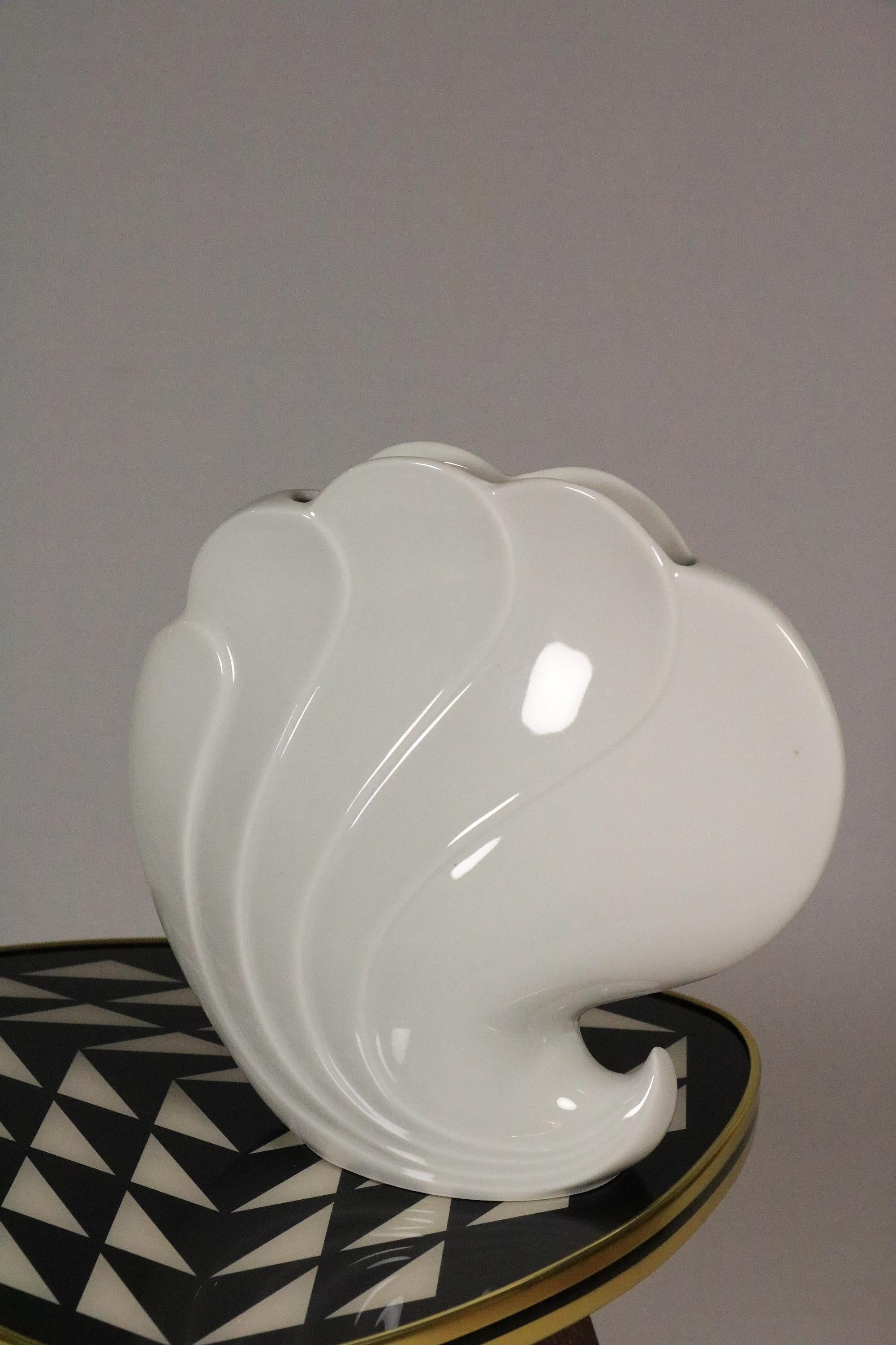 Very decorative Vase in white porcelain and shell Design.

By Seltmann, Weiden, Germany.
Model: Helena

Fits to many styles and other objects.
Looks also good without flowers.

Width: 23 cm /  9.05 inches
Height: 22 cm / 8.66 inches
Depth: 9 cm /