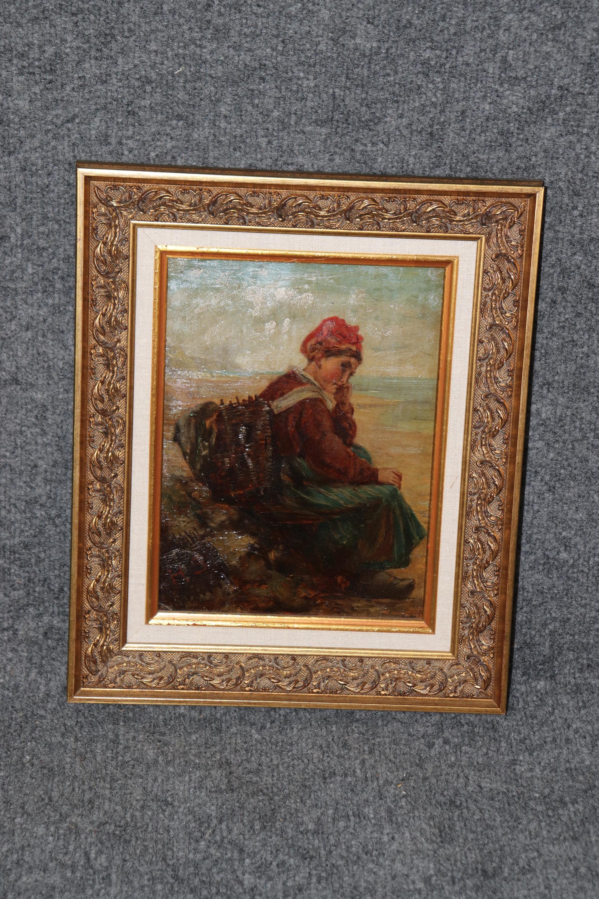 This is a beautifully framed and matted oil on board painting of a young woman apparrently collecting objects on a beach. The woman is dresser in what I believe are Arab clothes and has a bag and interesting shoes. The painting is signed H.S.
