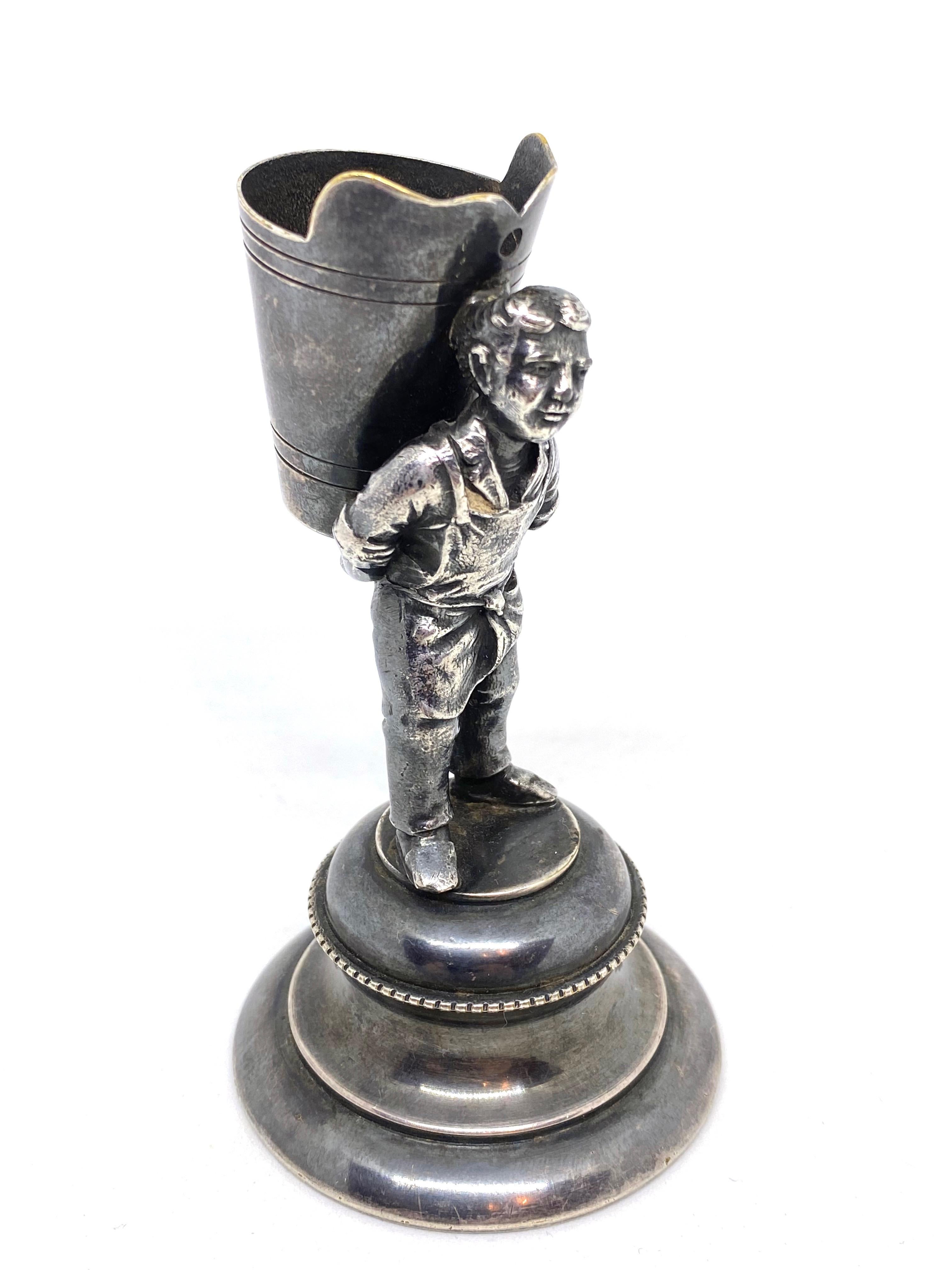 An antique decorative toothpick holder figure. Made of silver plated metal. A nice original antique item for displaying or just to use on your table. It is in the original as found condition. This piece has a beautiful patina and is in very good