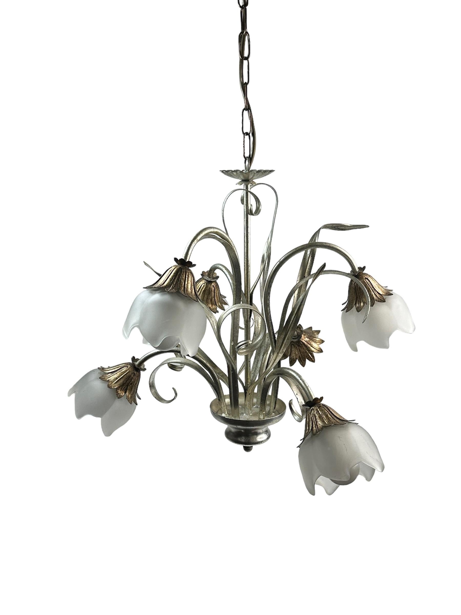 Petite Florentine style six-light chandelier. Functions as is with six E14 / 110 Volt light bulbs. Can take up to 40 Watts each bulb. Beautiful silvered metal chandelier. Chain with canopy approx. 18 inch high.
It gives the room a beautiful warm