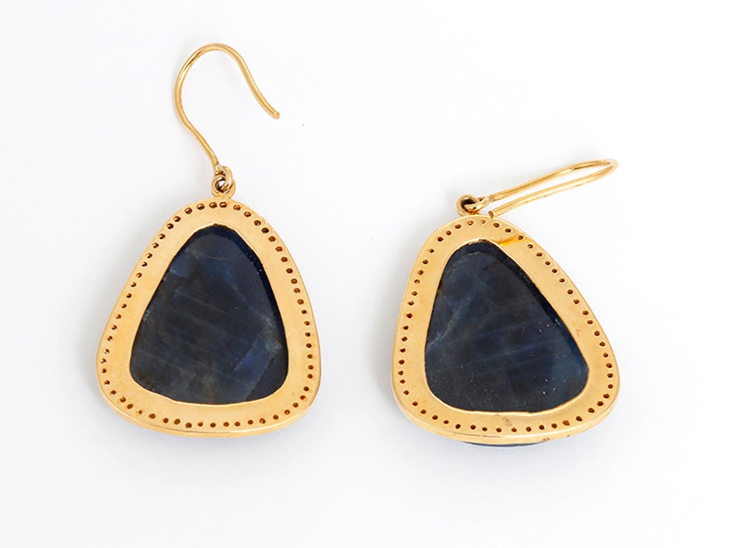 These beautiful earrings feature sliced faceted sapphire bordered by 0.39 carats of diamonds set in silver, 18k yellow gold plated. The earrings measure apx. 1-1/4 inches in length and 1-inch in width at the widest. Total weight is 19.5 grams.