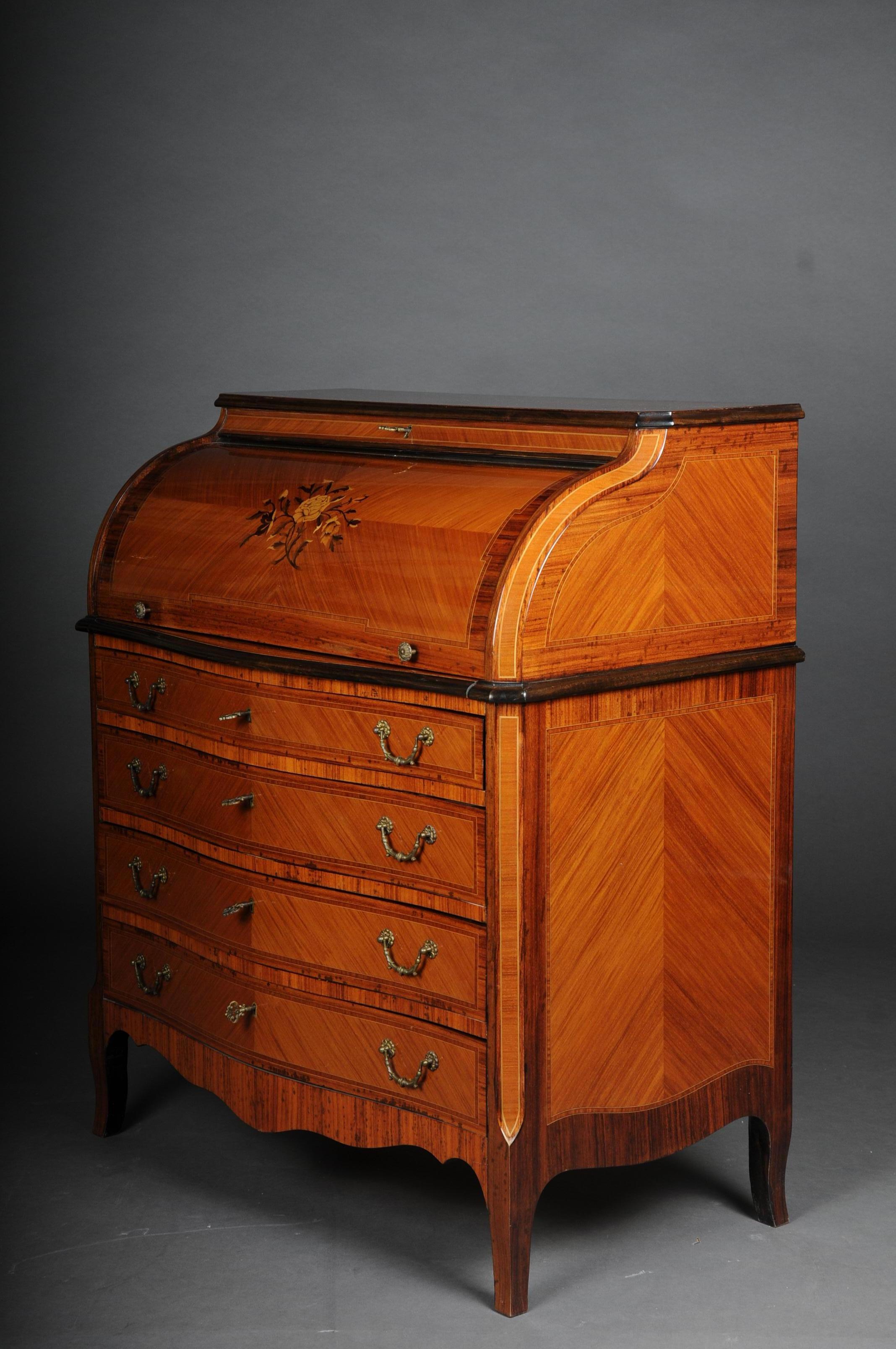 Beautiful sloping flap secretary / roll-up secretary, 20th century

Wood veneered with tulip wood and partially inlaid. High-quality workmanship on short square legs, straight four-drawer body, above it a roll-shaped flap and staggered office