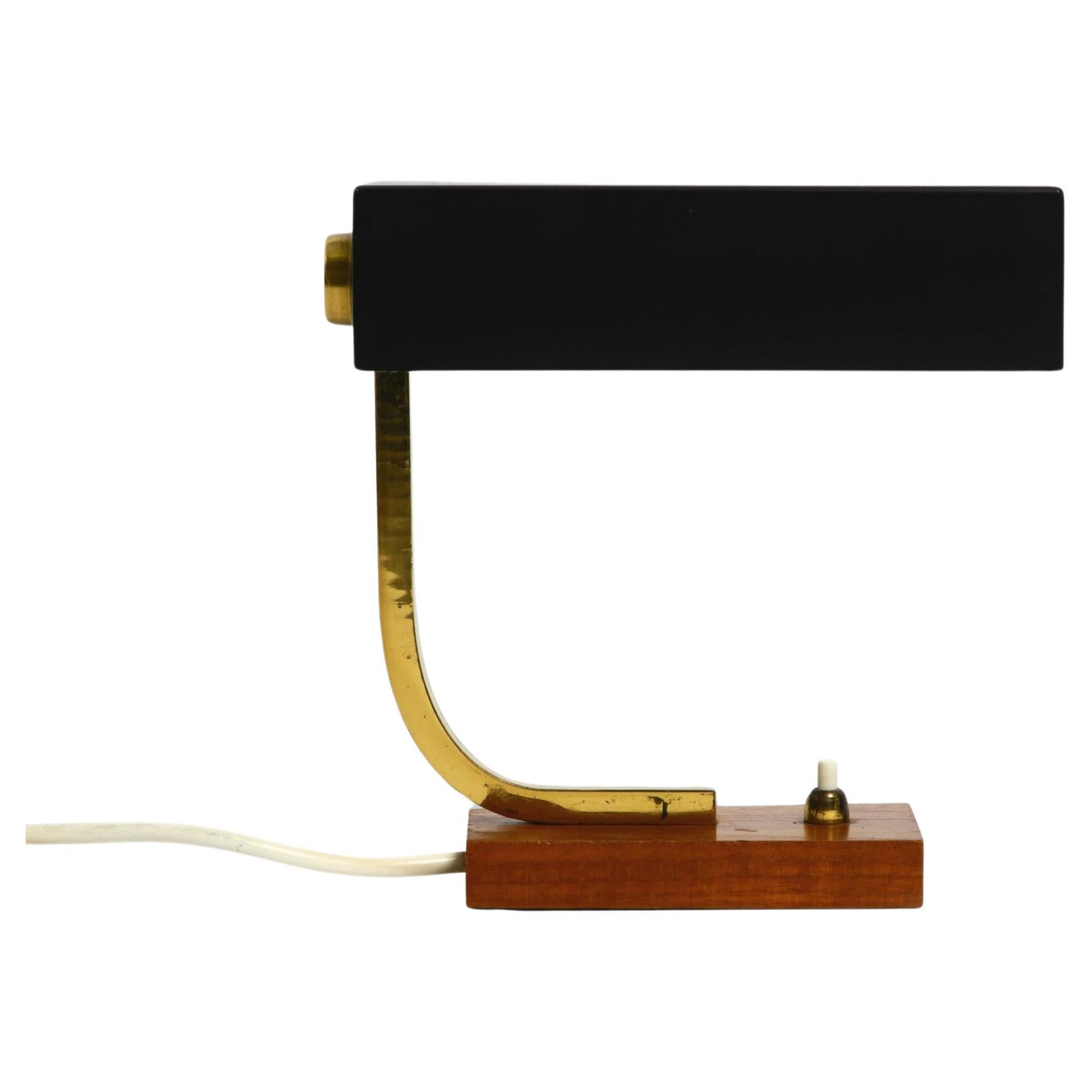Beautiful small Mid Century Modern metal and brass table lamp with teak base For Sale