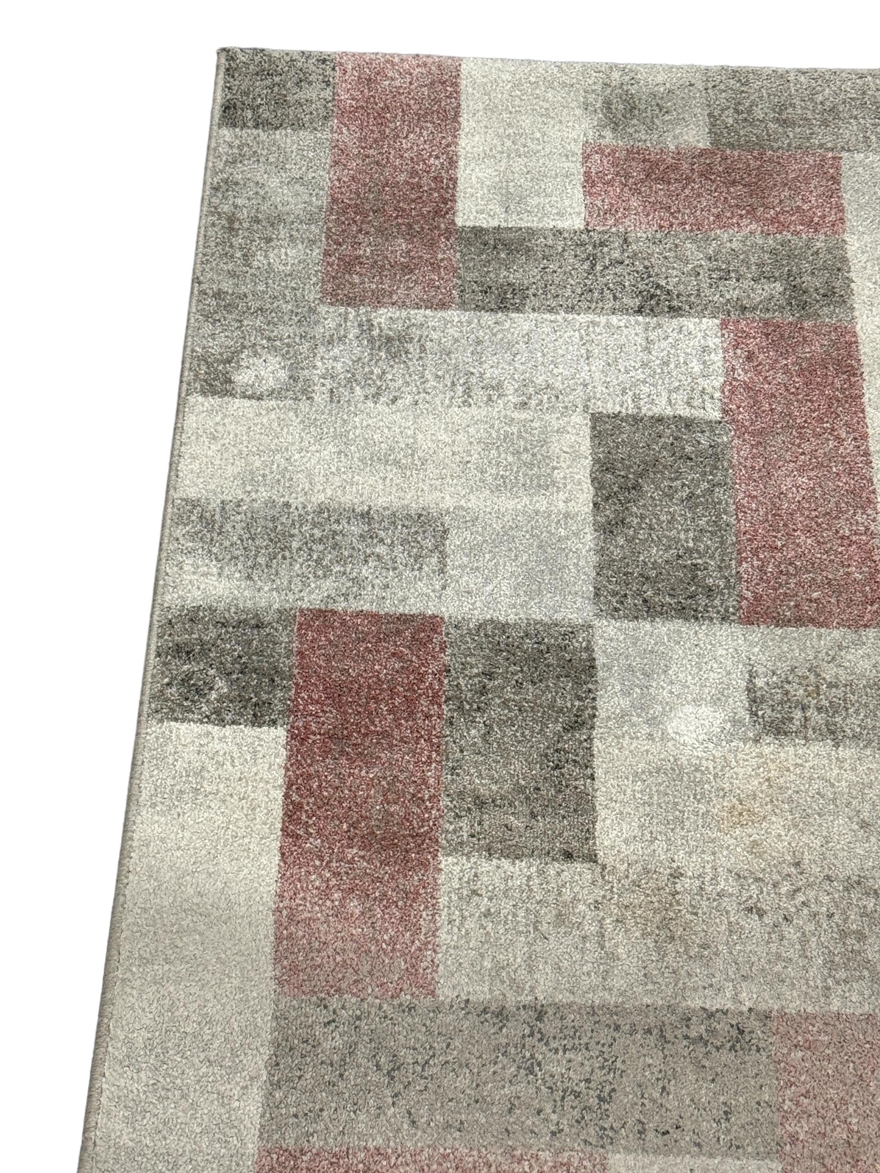 This rug is a great example of 1980s modern interior. Made in high quality weaving technique. This high quality high pile rug was designed in the 1980s and manufactured in Belgium. It is made from wool and it is still in a good vintage condition.