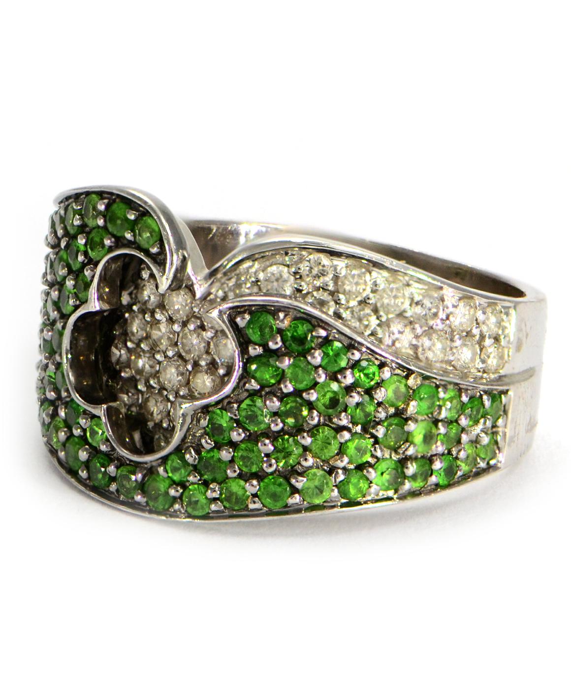 This is a genuine Tsavorite Garnet & natural diamond ring set in solid 14K white gold in excellent condition! There are 85 round tsavorite garnets and 33 round brilliant diamonds weighing approximately 1.00CTTW. The Diamonds are H SI1. The ring is a