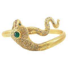 Beautiful solid gold serpent bangle with diamond, emerald and ruby
