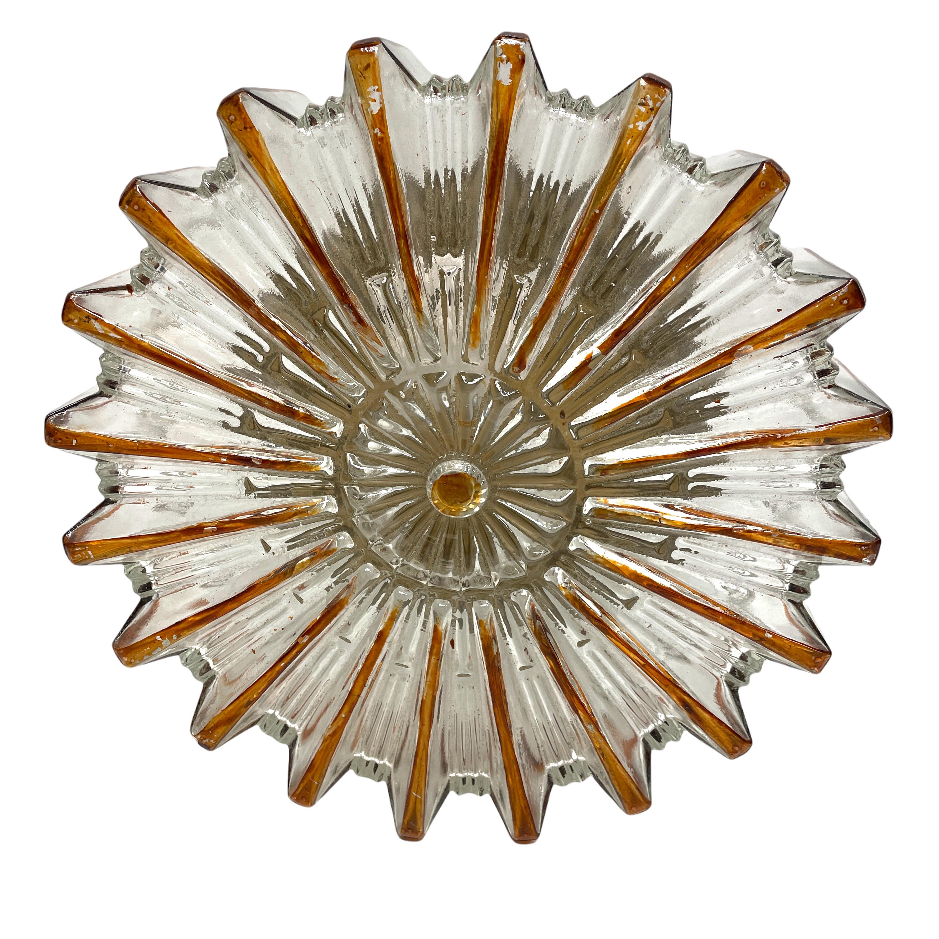 Beautiful starburst pattern flush mount. Made in Germany by Glashuette Limburg. Gorgeous textured glass flush mount with metal fixture. The Fixture requires one European E27 / 110 Volt Edison bulb, up to 100 watts.