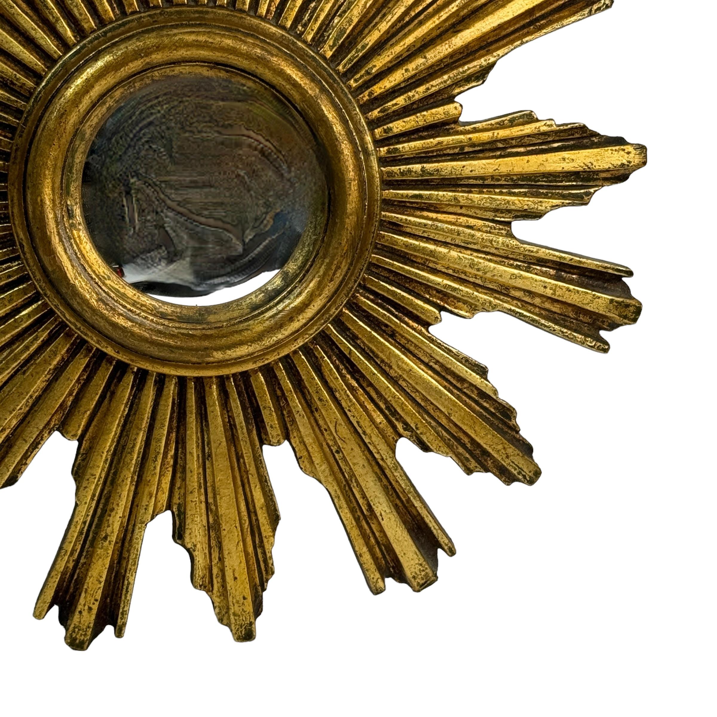 Hollywood Regency Beautiful Starburst Sunburst Gilded Resin Convex Mirror Belgium, circa 1960s For Sale