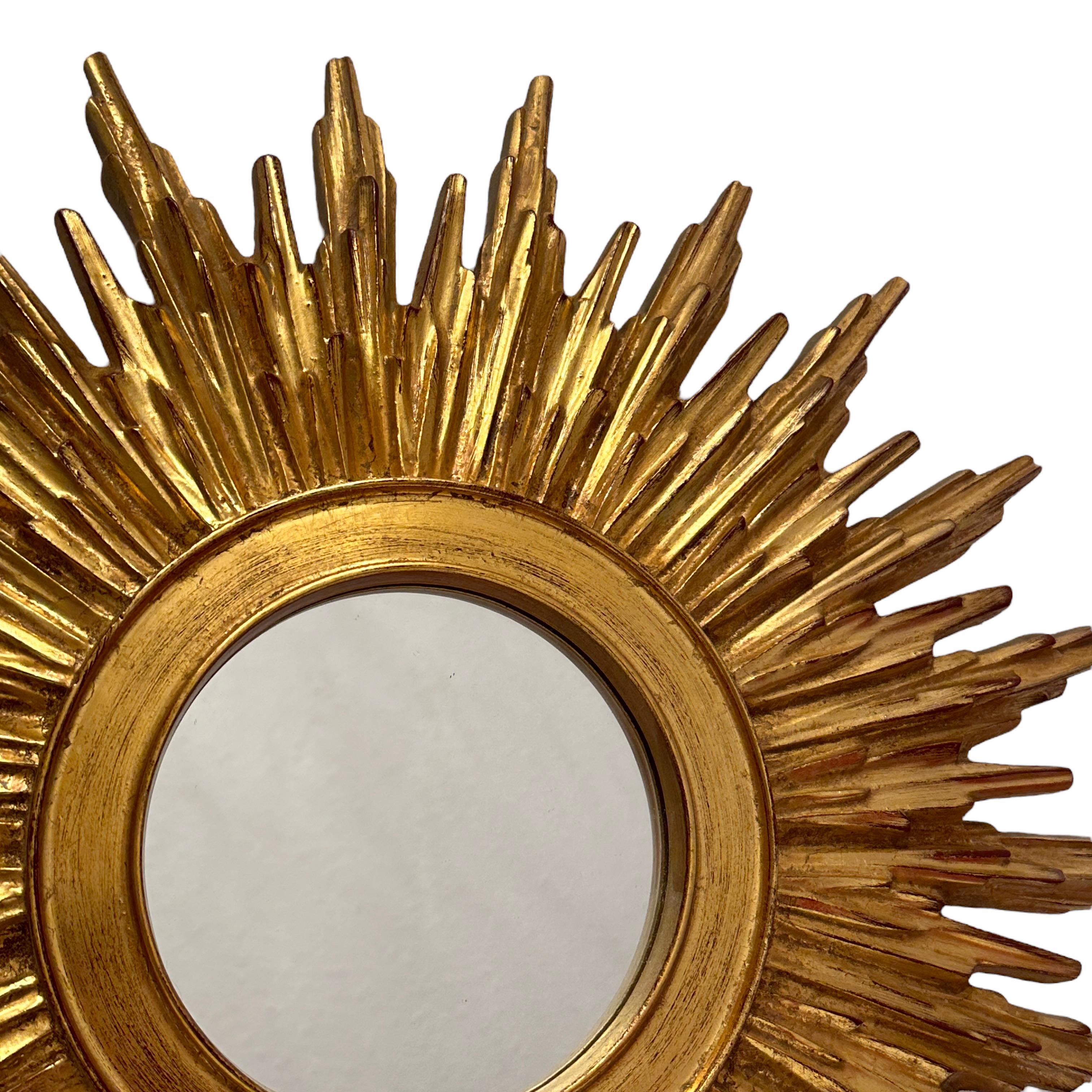 Gilt Beautiful Starburst Sunburst Gilded Resin Mirror Belgium, circa 1960s