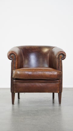 Beautiful stately English-style sheepskin club armchair with a luxurious finish