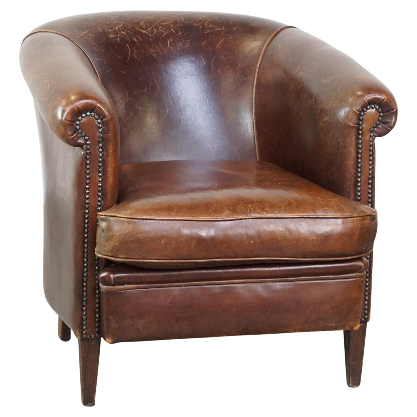 Beautiful stately English-style sheepskin club armchair with a luxurious finish