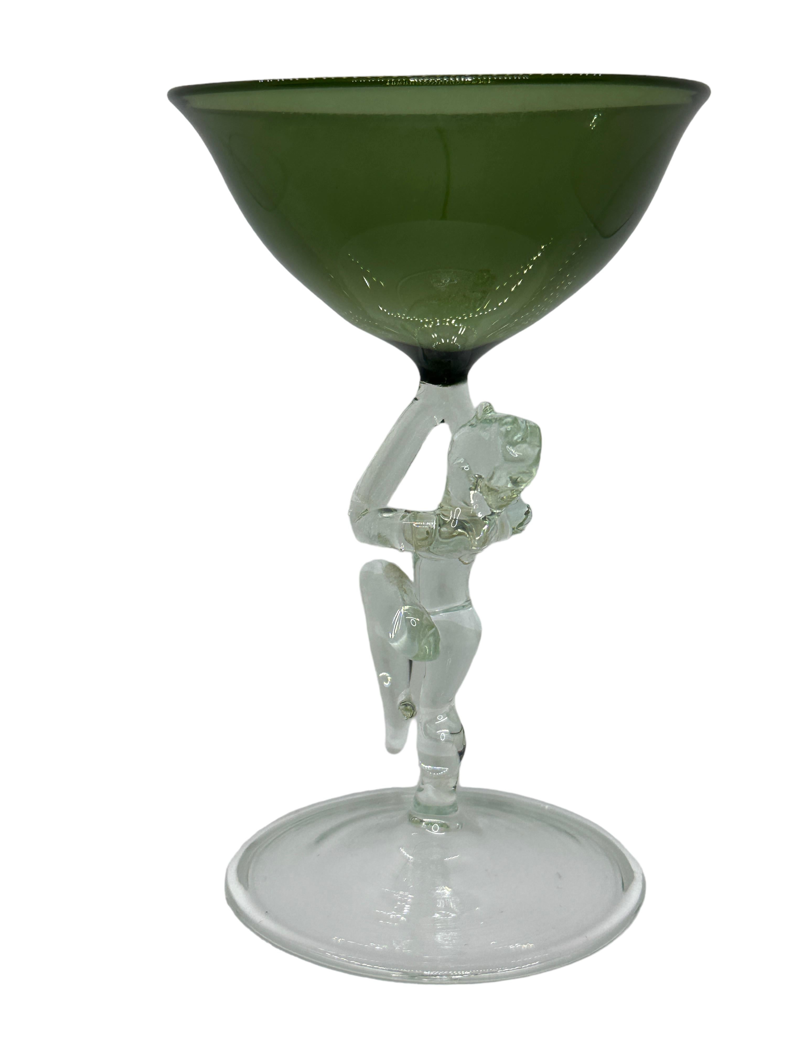 This is a beautiful single vintage stemmed cocktail glass from Austria. It features a bare women's shaft and is Bimini art style. The glass has a wonderful design, the stem depicts a nude lady in clear color. The base is a beautiful clear glass. The