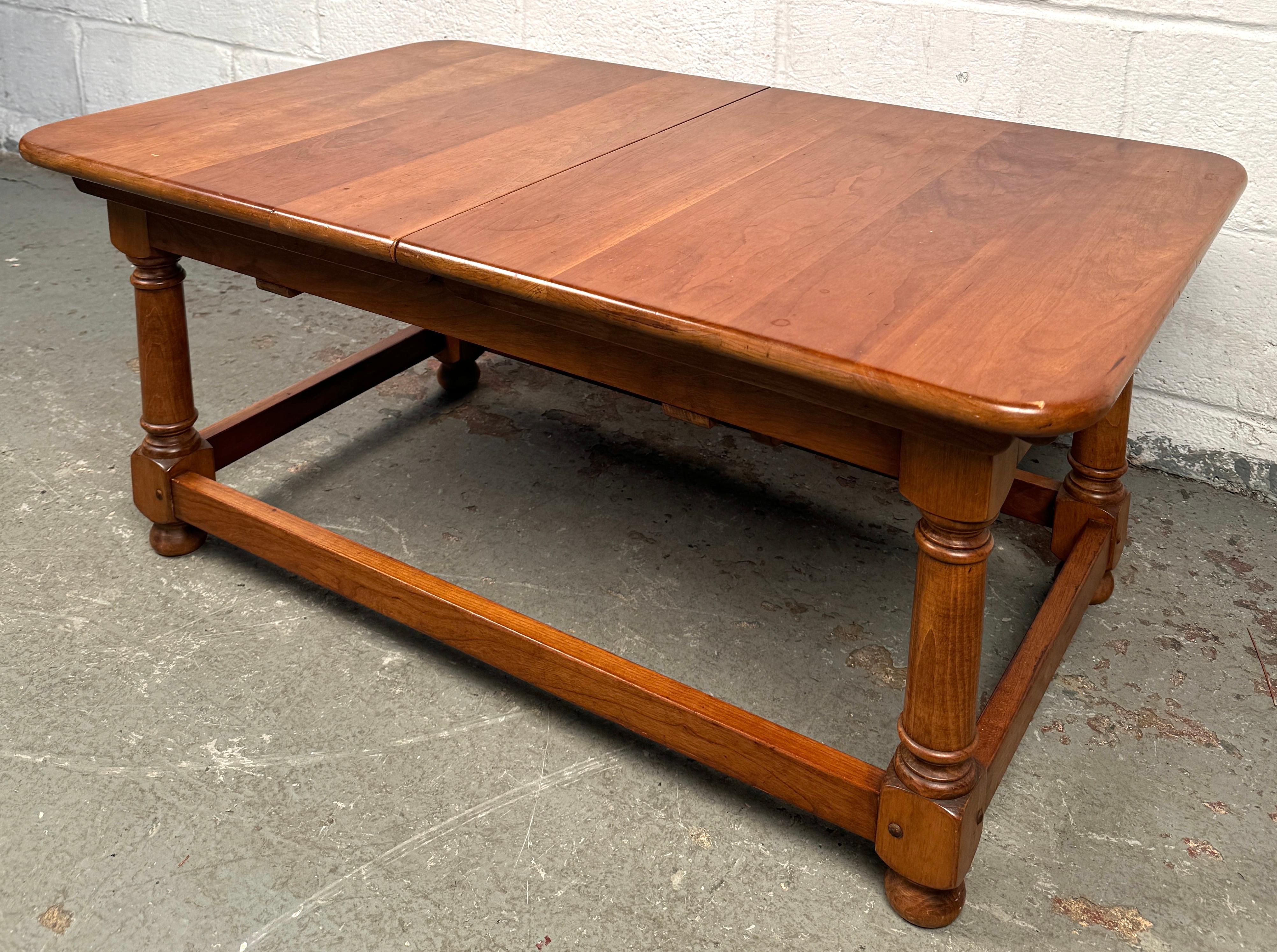 Elevate your living space with this stunning Stickley Maple Draw Leaf Coffee Table, a perfect blend of traditional craftsmanship and functional design. Handcrafted from solid maple and finished in a warm, rich stain that highlights the natural