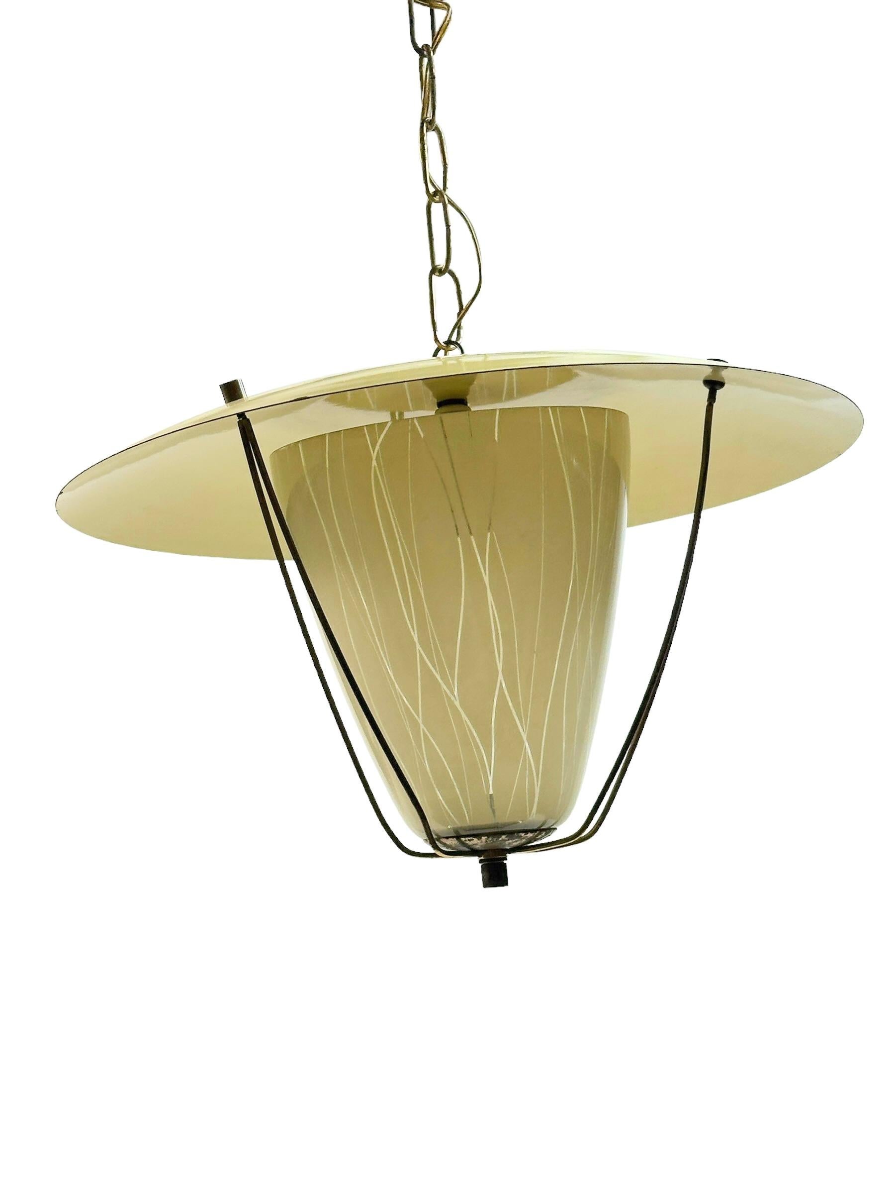 Very decorative and beautiful chandelier lantern pendant made of brass and metal, fitted with an E27/E26 socket. Made in Italy in the 1950s, attributed to the famous well known Stilnovo Manufacturer. The Fixture requires one European E27 / 110 Volt