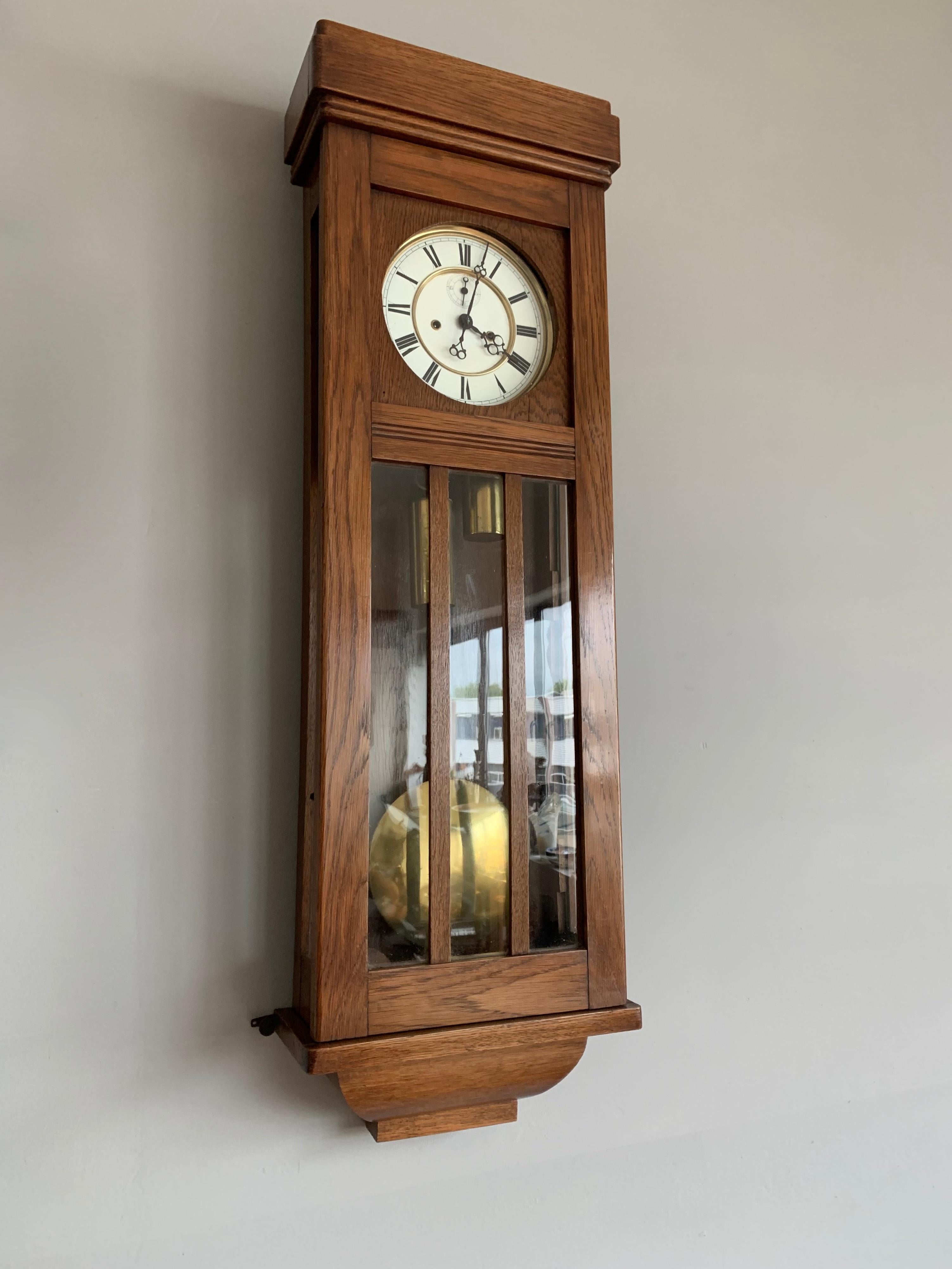 Early 1900s Viennese regulator, two weight wall clock in a handcrafted oak and glass case.

If you are looking for a stylish clock then this tall and sleek antique could be gracing the wall of your home or office space soon. All handcrafted in the
