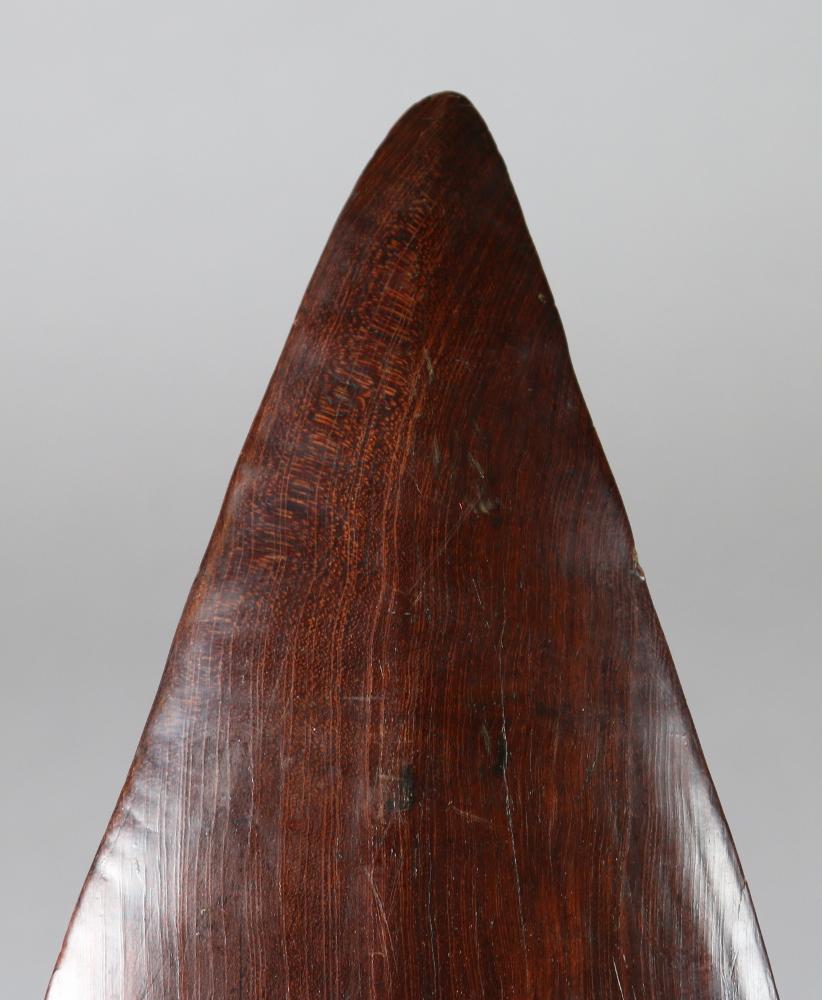 19th century Solomon Islands Club. A Supi Battle club, Malaita Island. Lovely deep red brown patina.
Clubs of this sort were used in striking attacks, the width used to protect the head when entering a
building. Often used to 'finish off' the