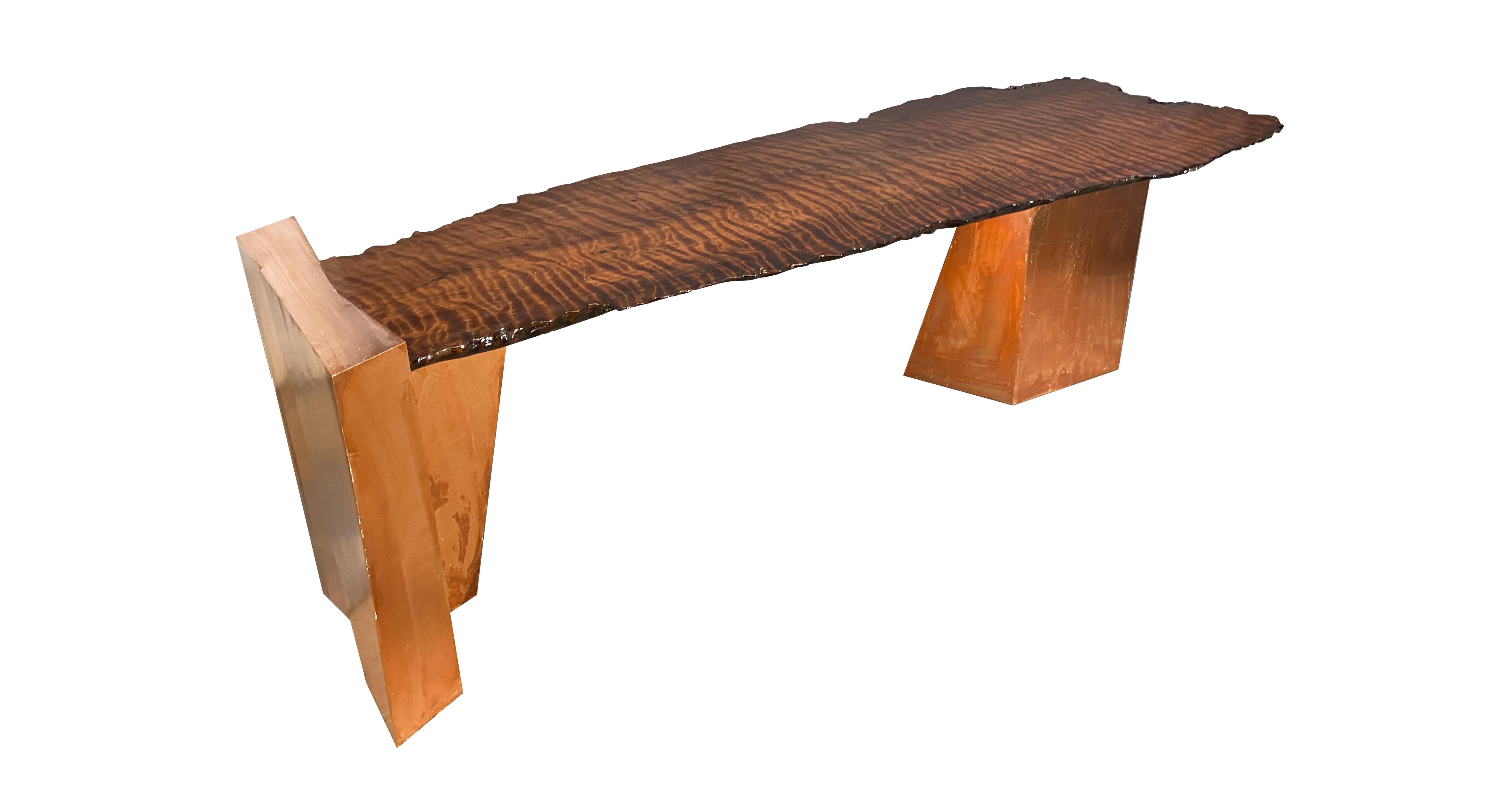 Form: A Natural Live Edge Coffee Table 
 
Materials: Solid American “Old Growth” highly figured Coastal Redwood (Sequoia sempervirens), FSA Certified Baltic Birch veneer core plywood, Copper leaf, moderately low VOC clear coating for the bases and