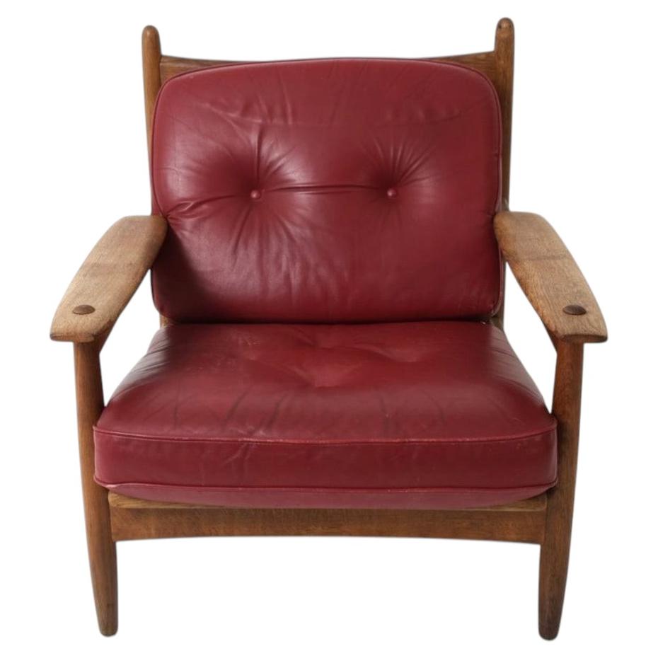 Beautiful Swedish brutalist Red Leather Oak frame low lounge chair For Sale