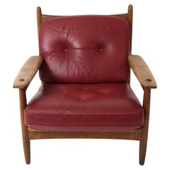 Beautiful Swedish brutalist Red Leather Oak frame low lounge chair