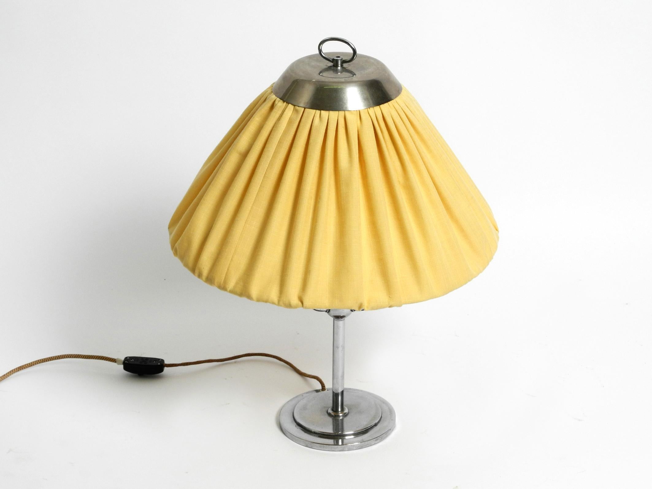 Beautiful Art Nouveau table lamp Nickel plated with fabric shade.
Design by Josef Hoffmann for Wiener Werkstätten. Made in Austria.
Manufactured in the 1910s. Great, very high-quality design in original vintage condition.
Nickel-plated metal