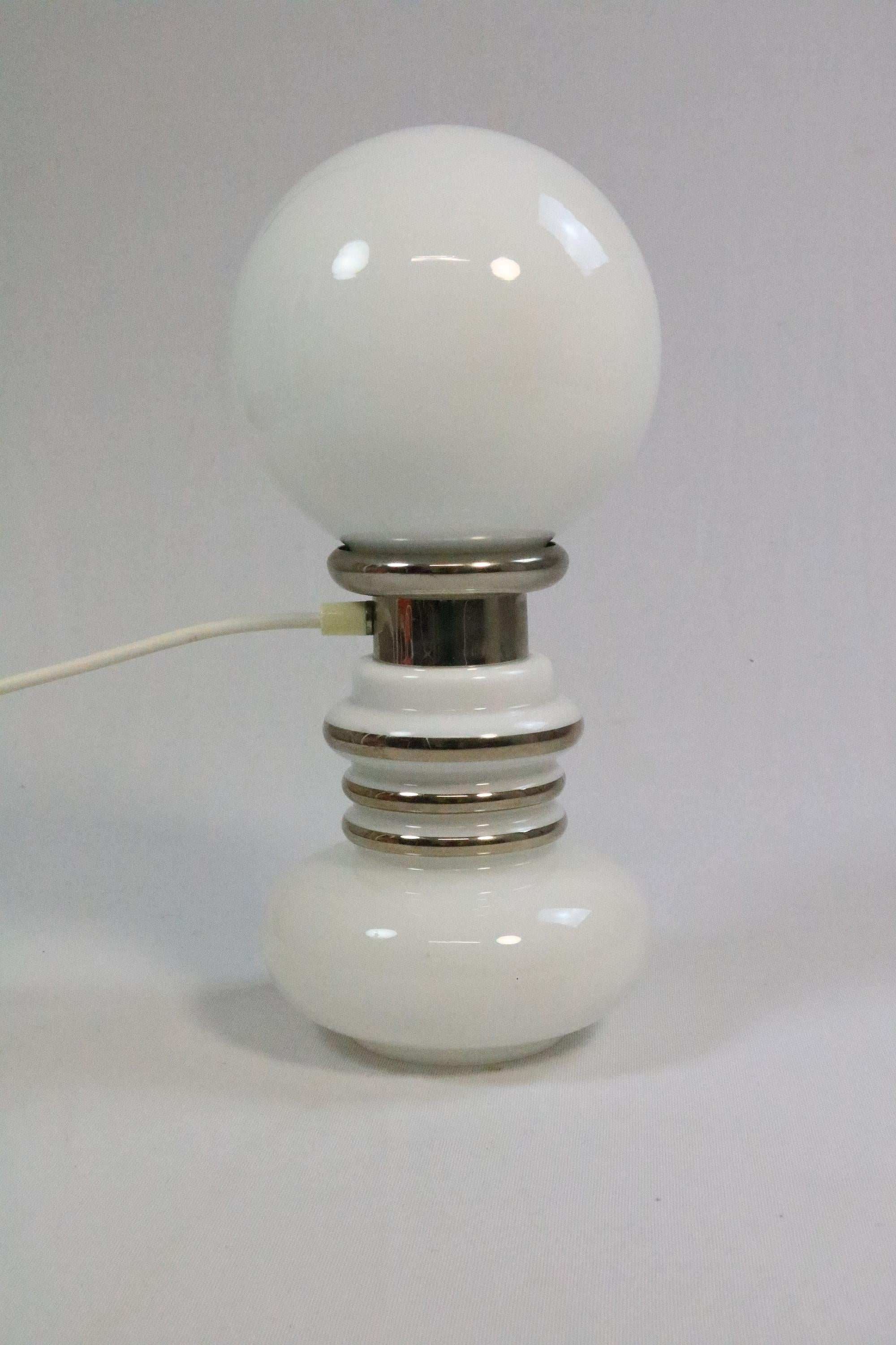 Large table lamp made of white opal glass and chrome.
In the style of the Murano table lamps by Carlo Nason.
 
Very beautiful light object, especially when turned on.
 
E14 socket, E27 socket on top. Not separately switchable.
 
Manufacturer