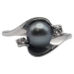 Anello bypass con perla di Tahiti e diamante 10W