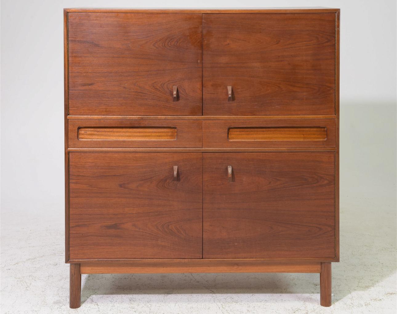 Beautiful tall sideboard designed by Tom Robertson for A.H. McIntosh in Scotland, circa 1960s. This beautiful cabinet has tons of storage space including four cupboards and two drawers. Overall in very good original condition. Structurally sound.