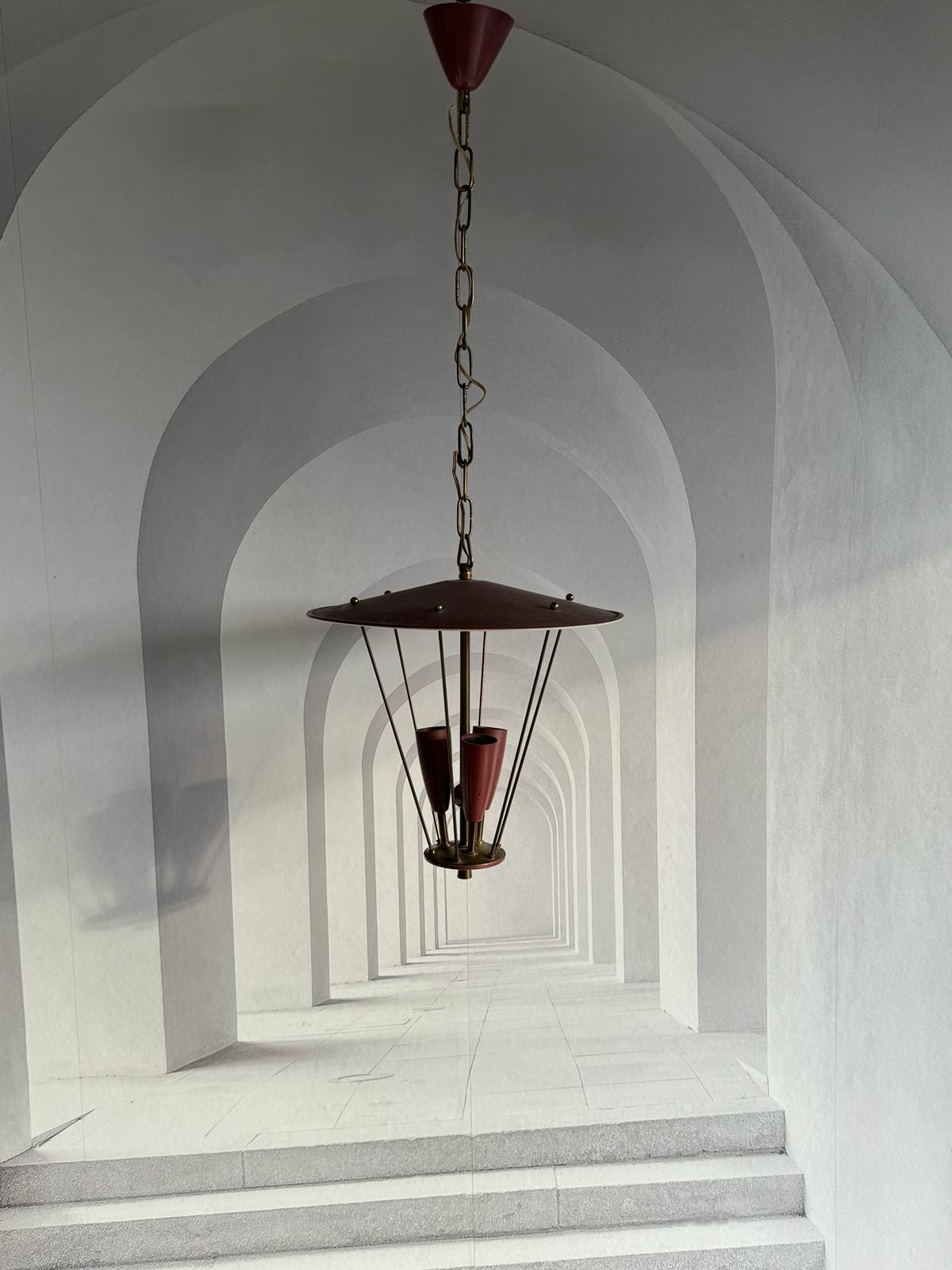 Very decorative and beautiful chandelier lantern pendant made of brass and metal, fitted with three E14 Sockets. Made in Italy in the 1950s, attributed to the famous well known Stilnovo Manufacturer. The Fixture requires three European E14 / 110