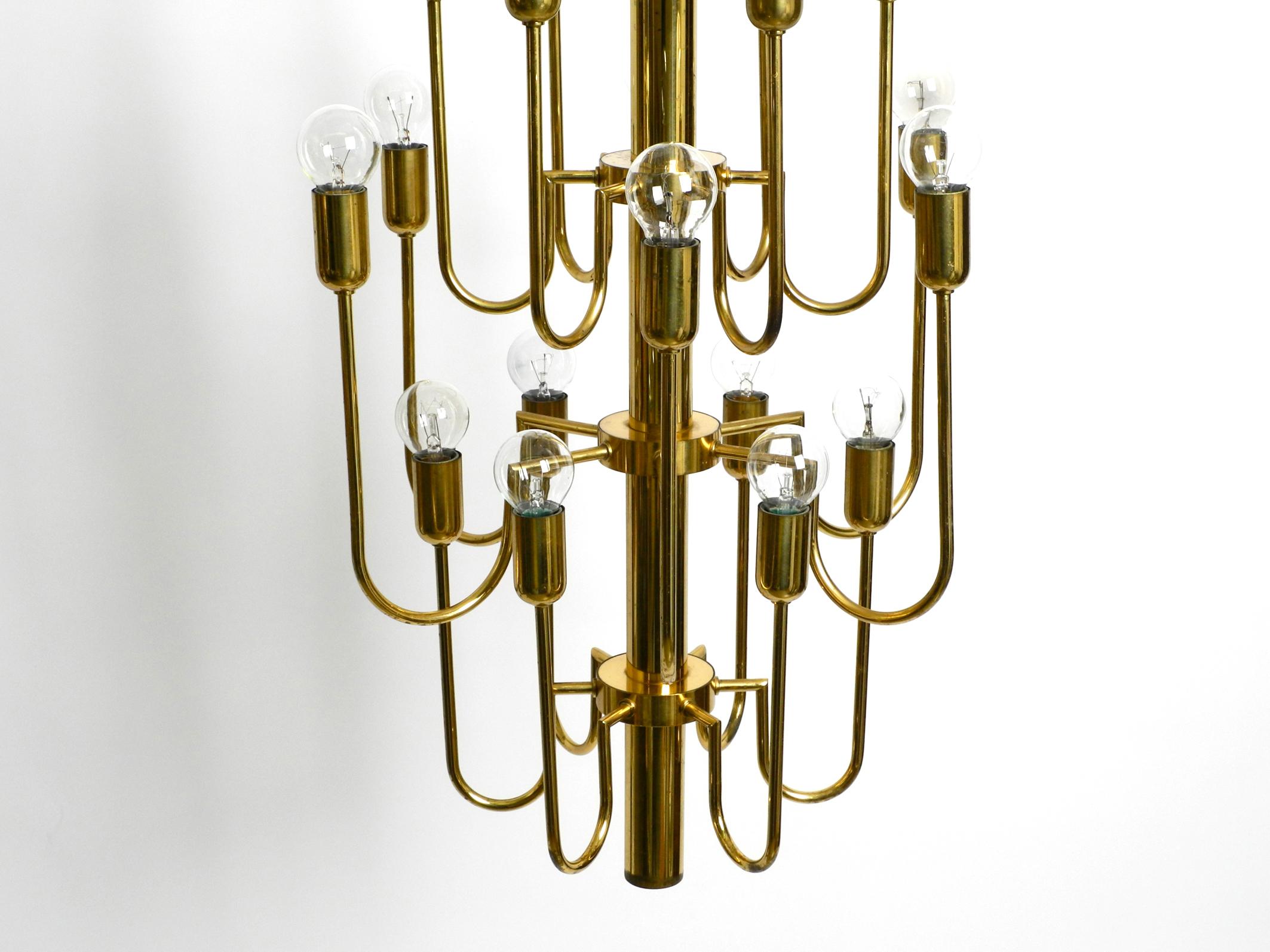 Beautiful Three Staged 18 Arm Midcentury Brass Chandelier with a Long Brass Rod For Sale 9