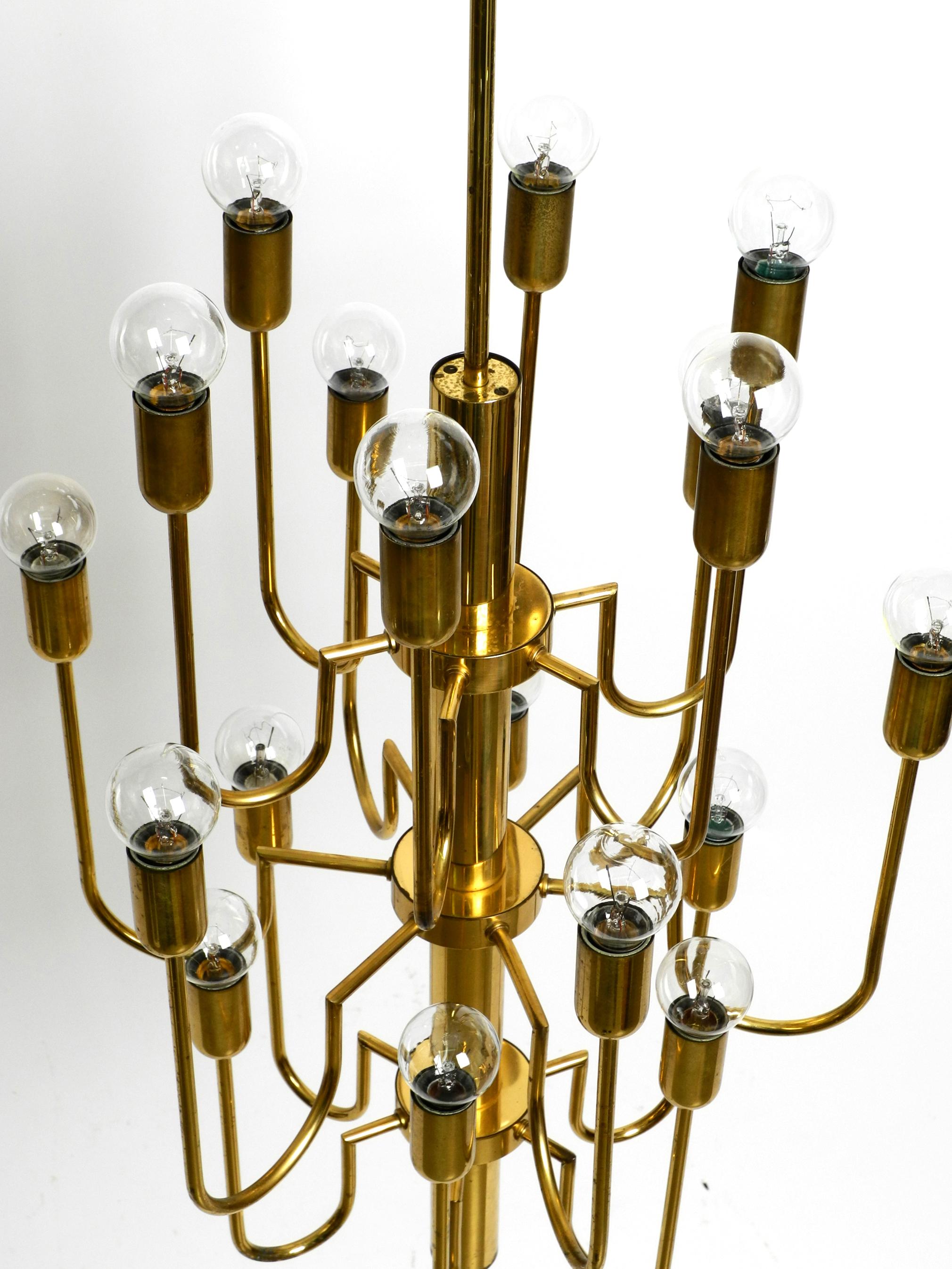 Beautiful Three Staged 18 Arm Midcentury Brass Chandelier with a Long Brass Rod For Sale 1