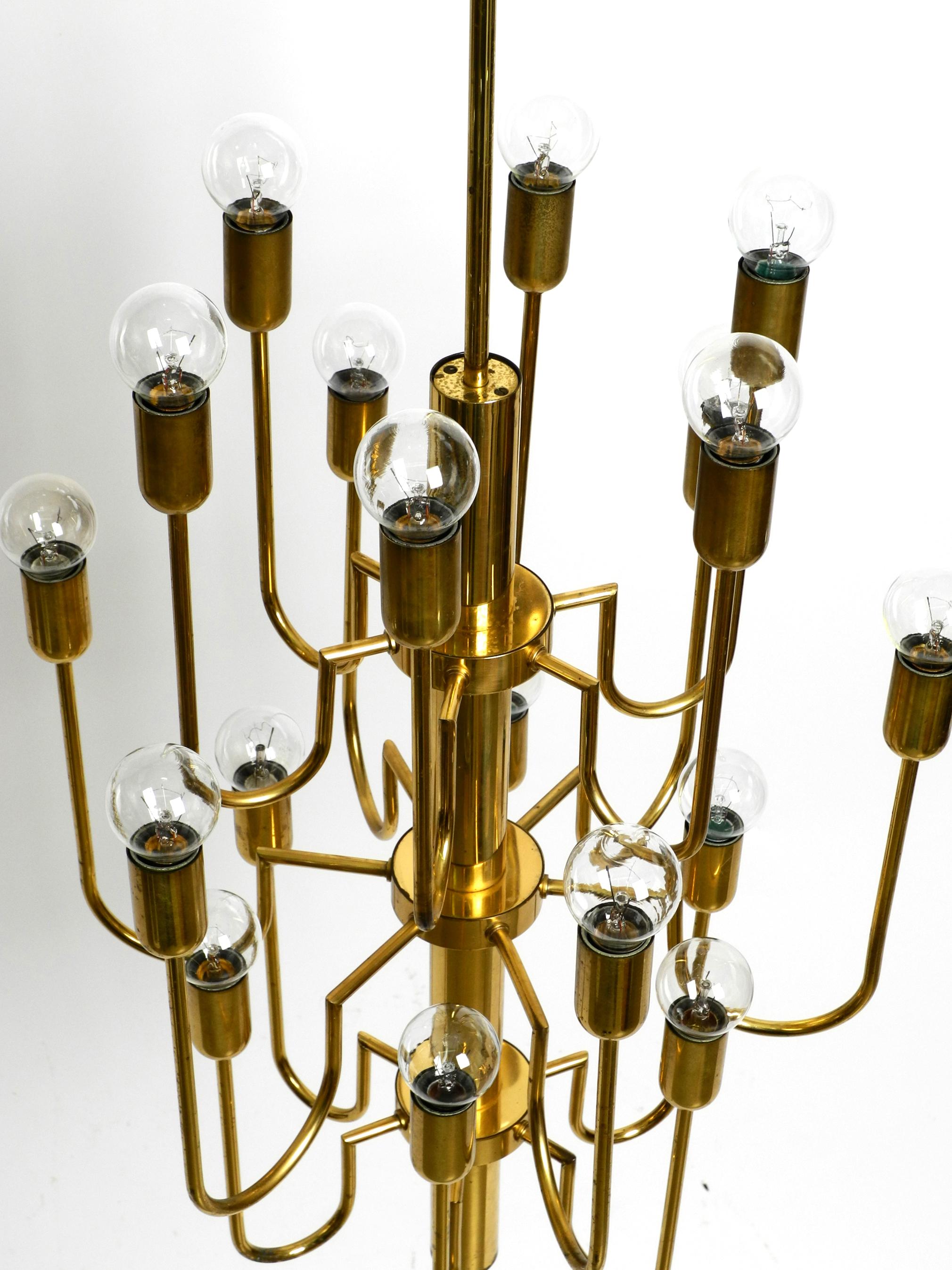 Mid-20th Century Beautiful three staged 18 arm Mid Century brass chandelier with a long brass rod For Sale