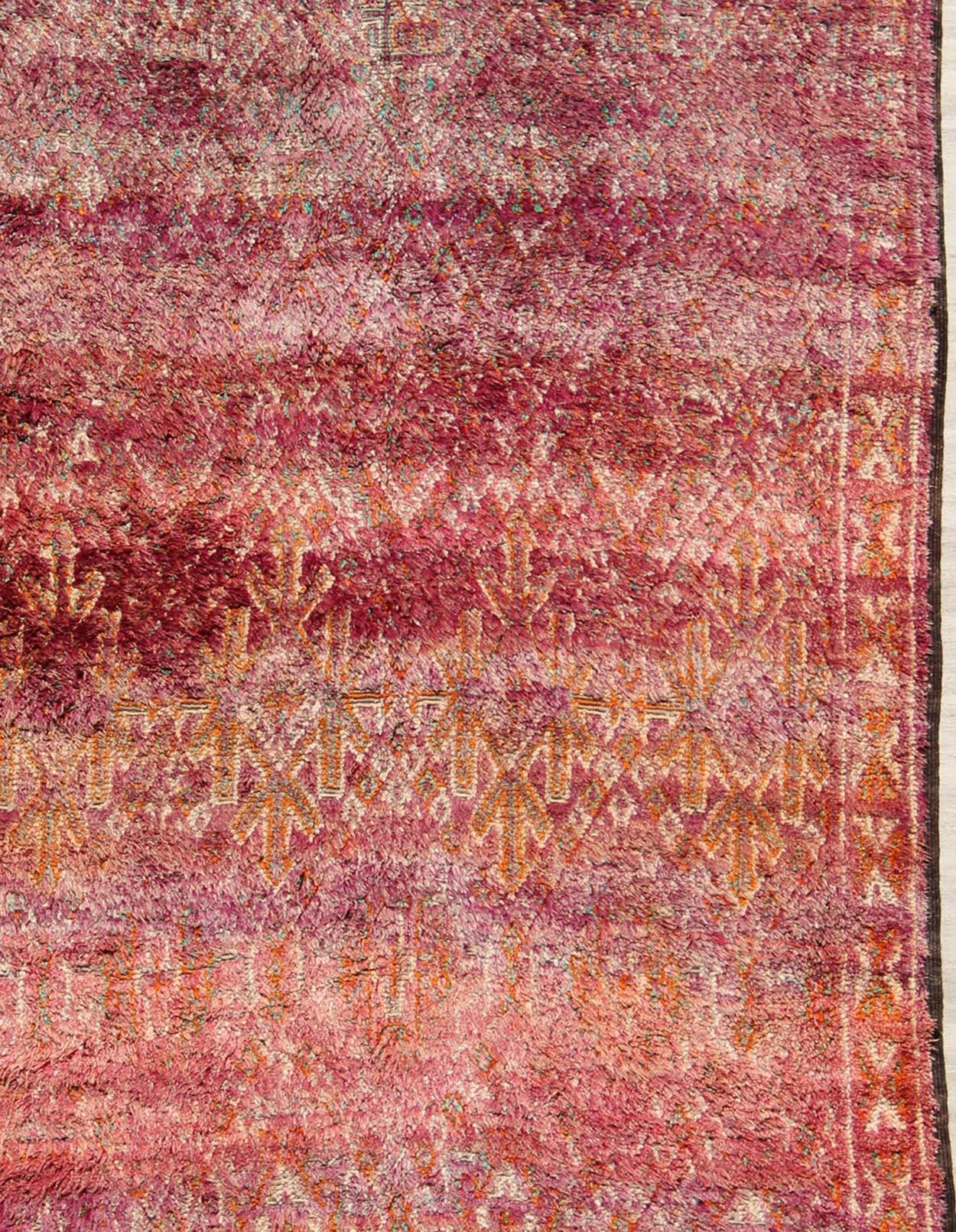 Tribal design Moroccan Vintage rug in Purple, Red, Orange, and Green rug KBE-LCB-18-22, country of origin / type: Morocco / Tribal, circa 1940.

This gorgeous vintage Moroccan carpet from the mid-20th century displays a stunning, all-over