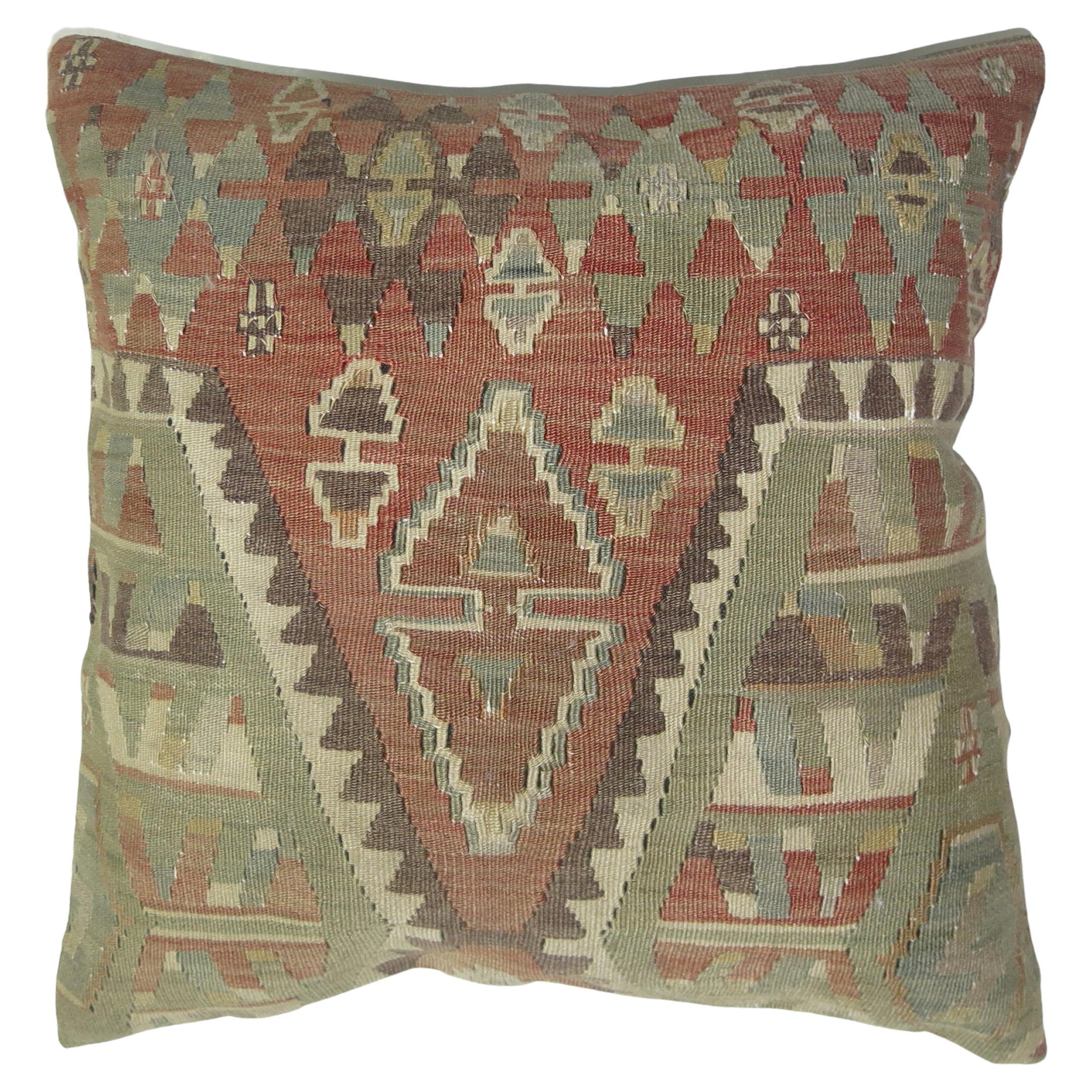 Pillow made from an early 20th century Turkish Kilim. Polyfill insert provided with a zipper closure

Measures: 19'' x 19''.